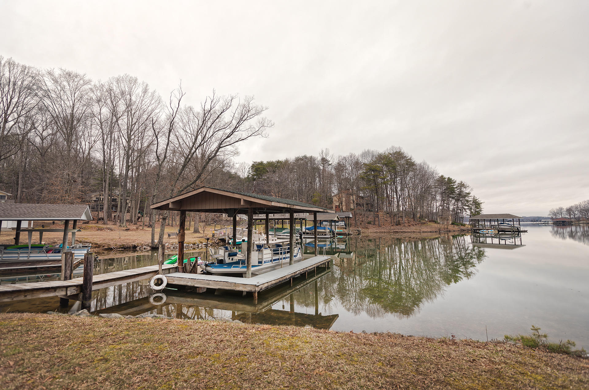 699 Highland Lake Road Union Hall, VA 24176 - Photo 26 of 33 a view of a lake with chairs in roof deck