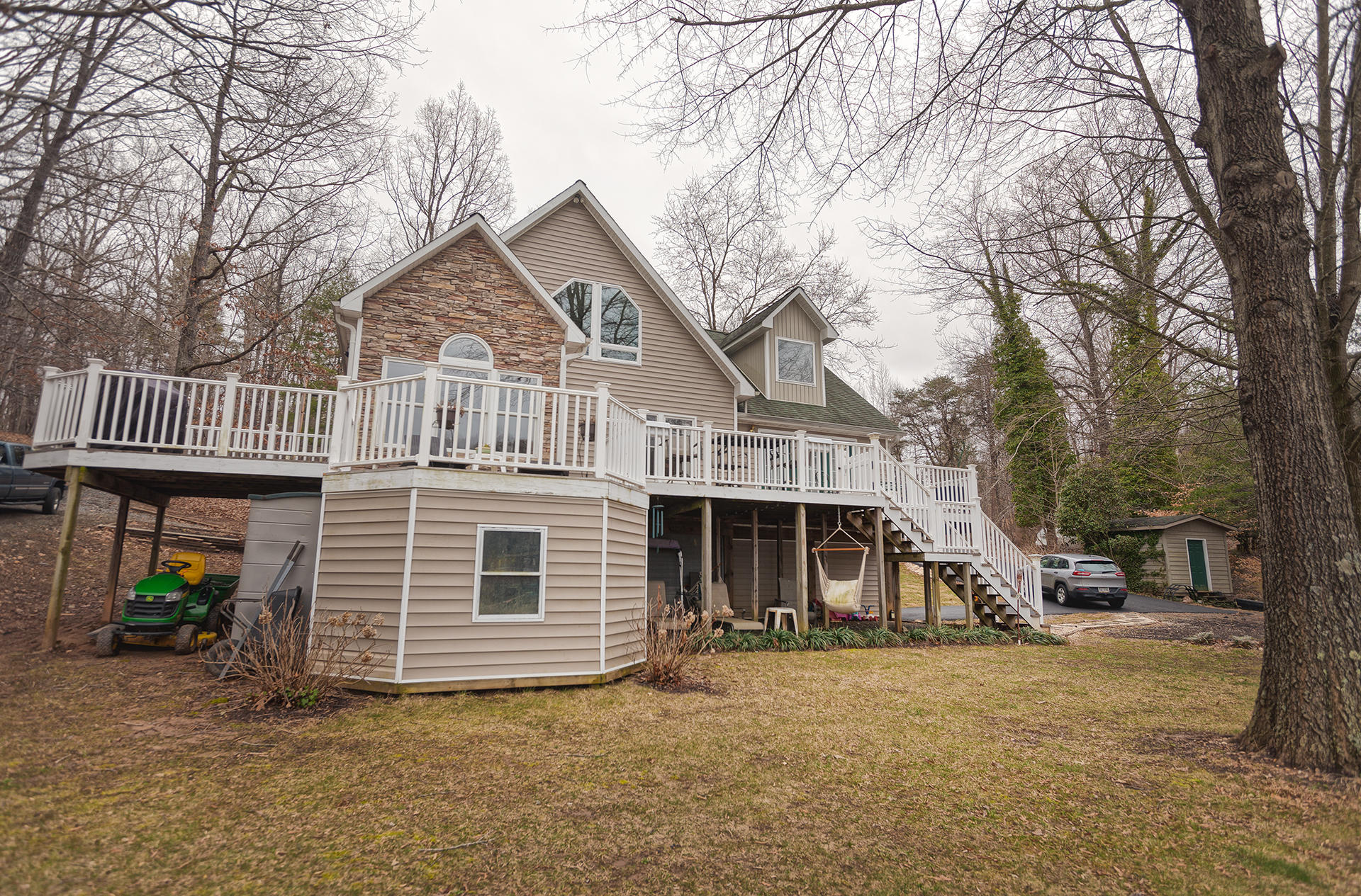 699 Highland Lake Road Union Hall, VA 24176 - Photo 27 of 33 a front view of a house with a yard and garage