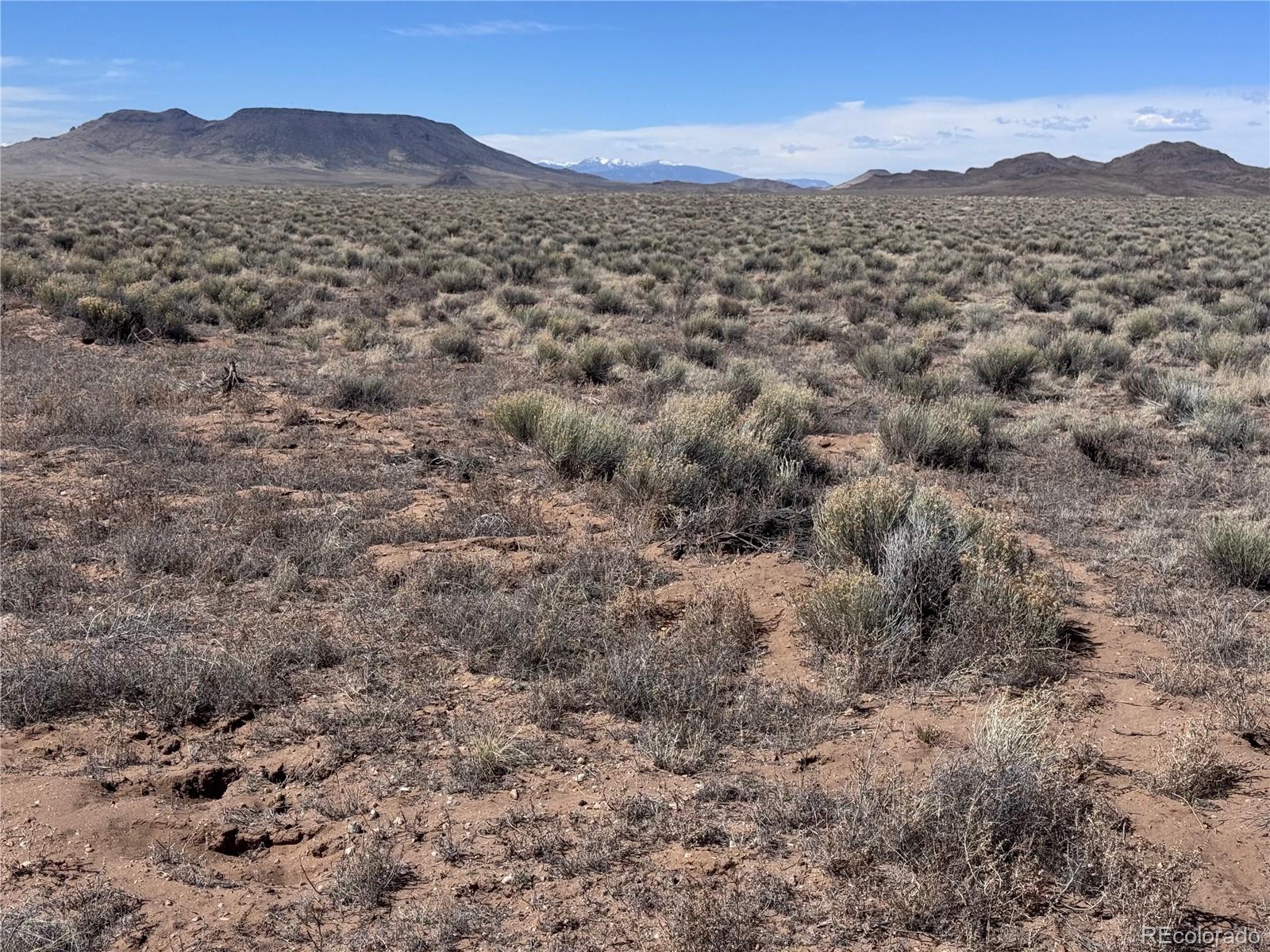 Lot 3 Ana Road Sanford, CO 81151 - Photo 3 of 13 a view of a mountain range with trees in the background