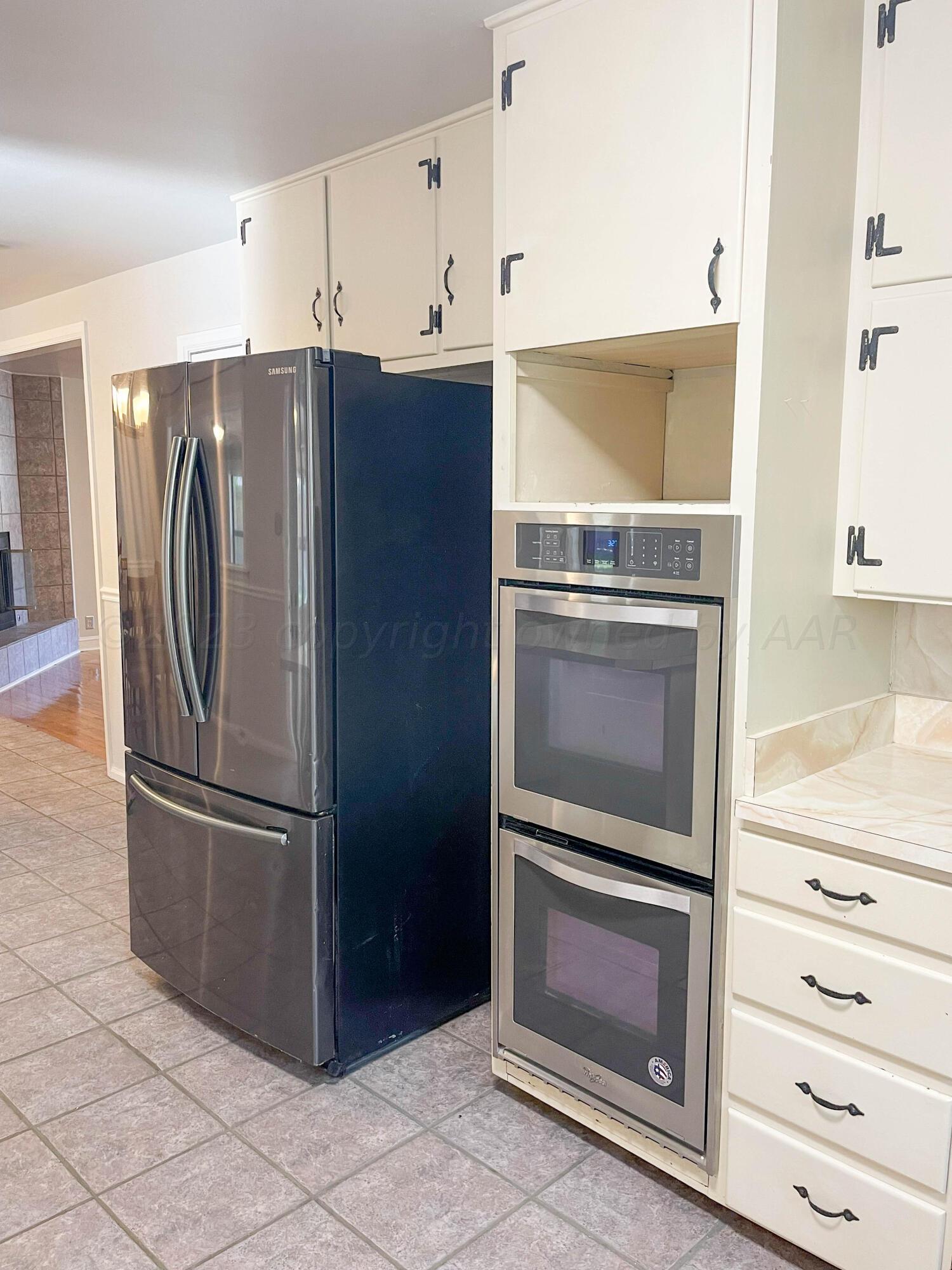 3707 Lynette Drive Amarillo, TX 79109 - Photo 11 of 45 a kitchen with granite countertop cabinets and stainless steel appliances