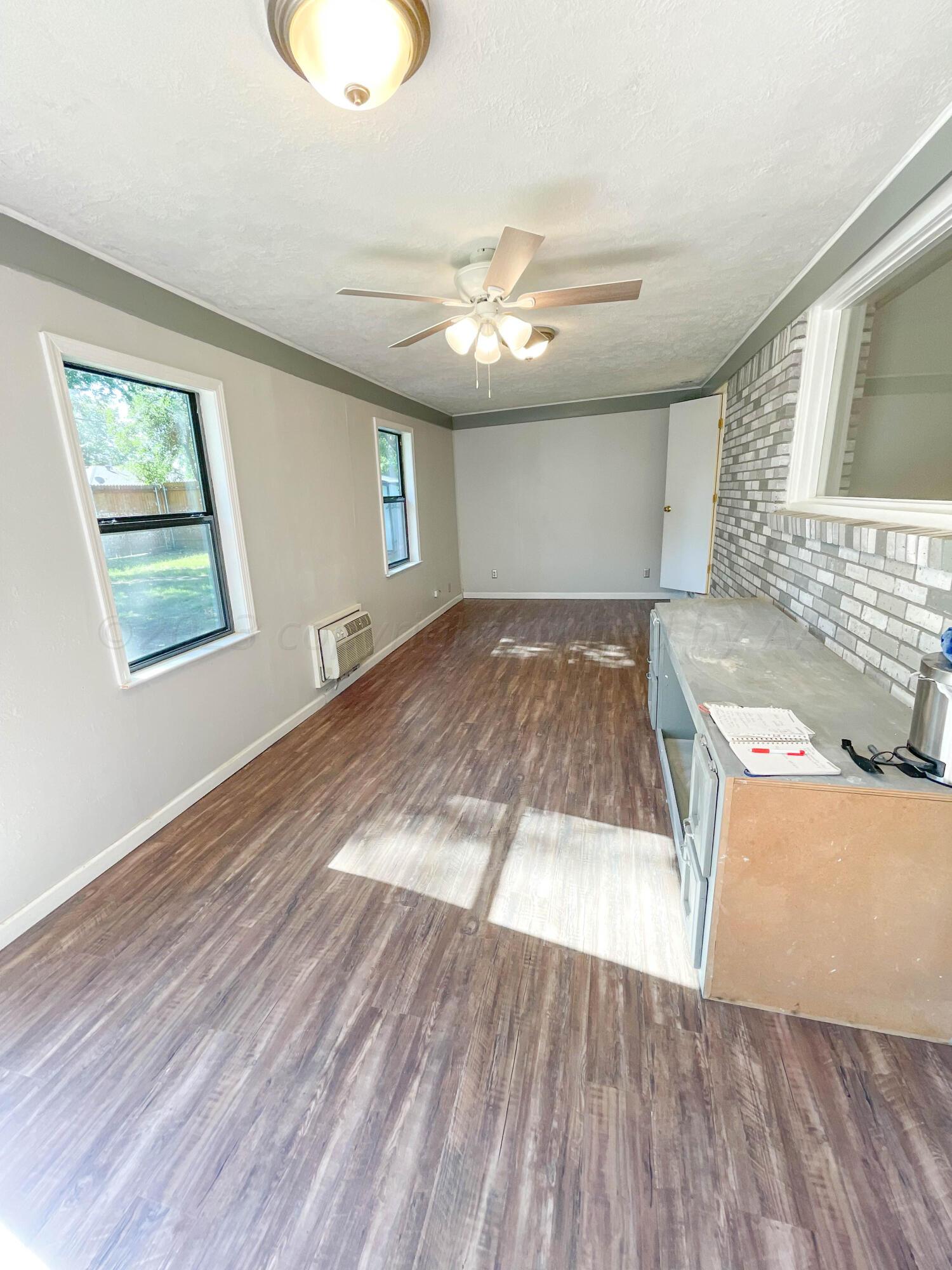 3707 Lynette Drive Amarillo, TX 79109 - Photo 16 of 45 a view of a livingroom with wooden floor