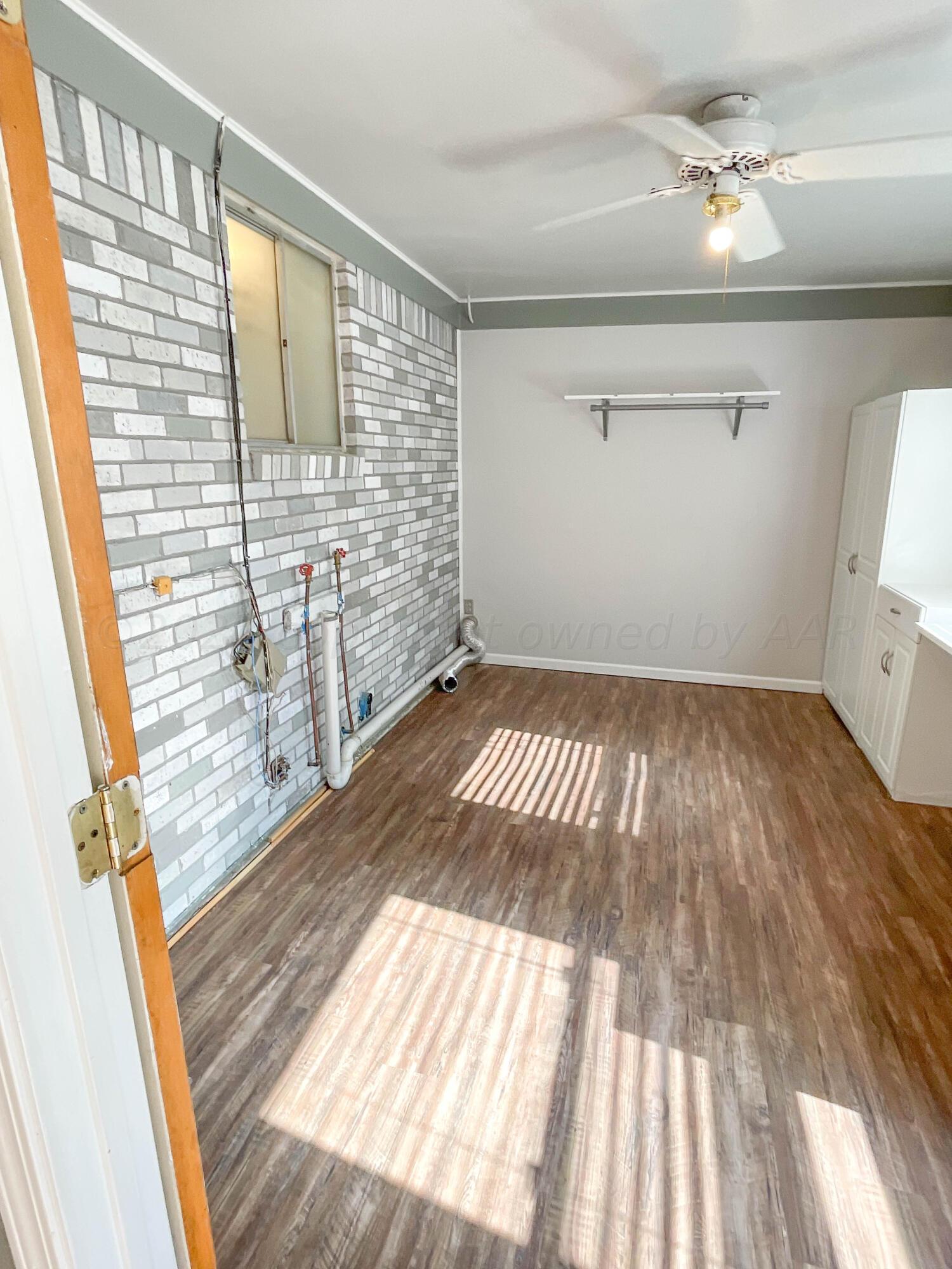 3707 Lynette Drive Amarillo, TX 79109 - Photo 18 of 45 a view of a room with wooden floor and fan