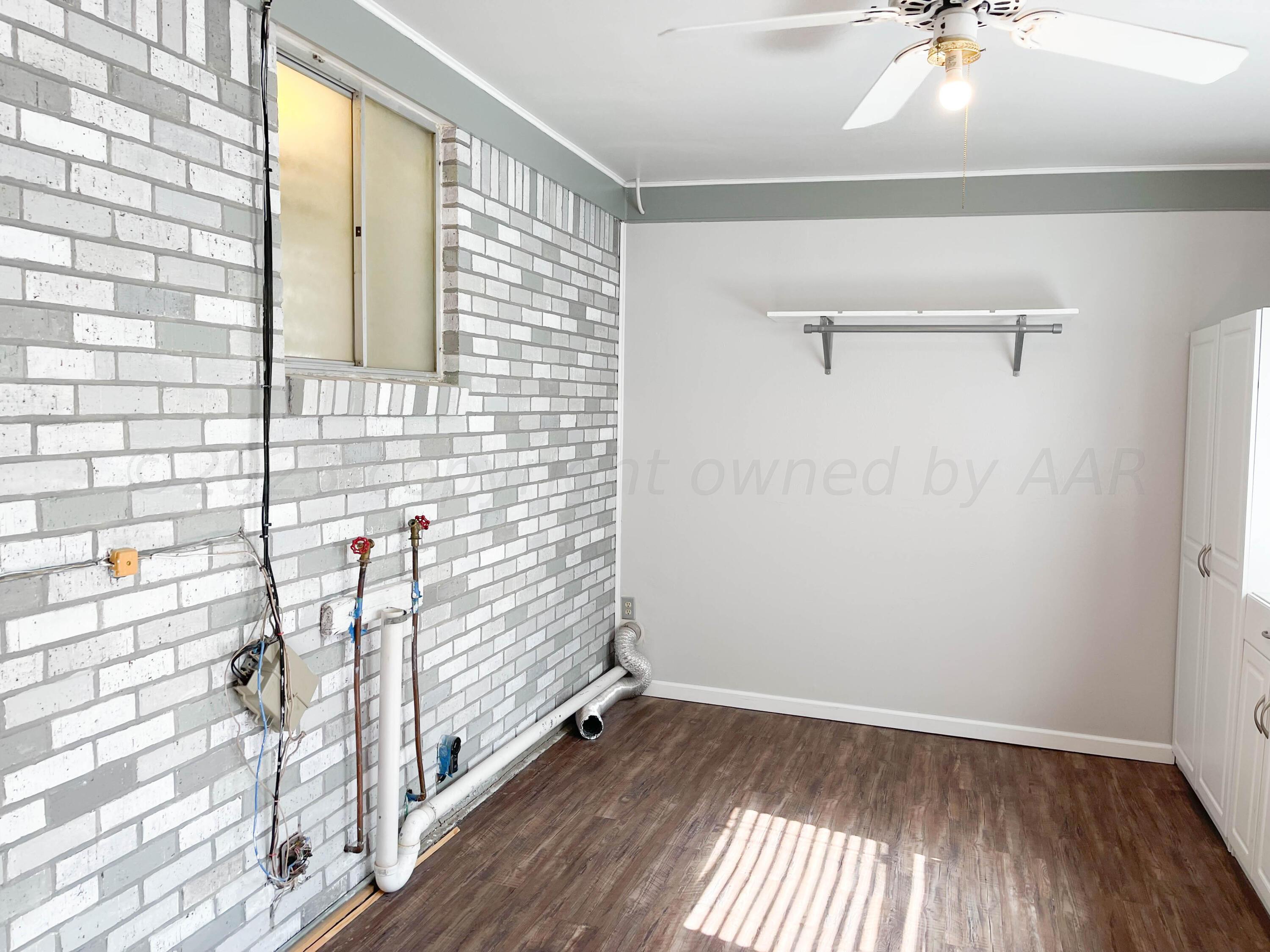 3707 Lynette Drive Amarillo, TX 79109 - Photo 20 of 45 a view of a room with wooden floor and fan