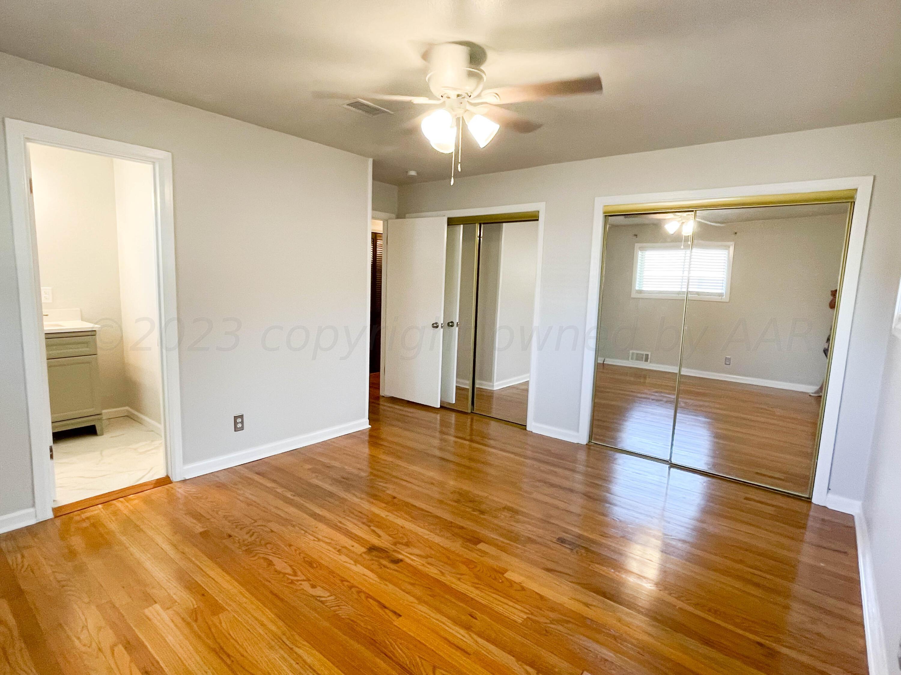 3707 Lynette Drive Amarillo, TX 79109 - Photo 22 of 45 a view of empty room with wooden floor