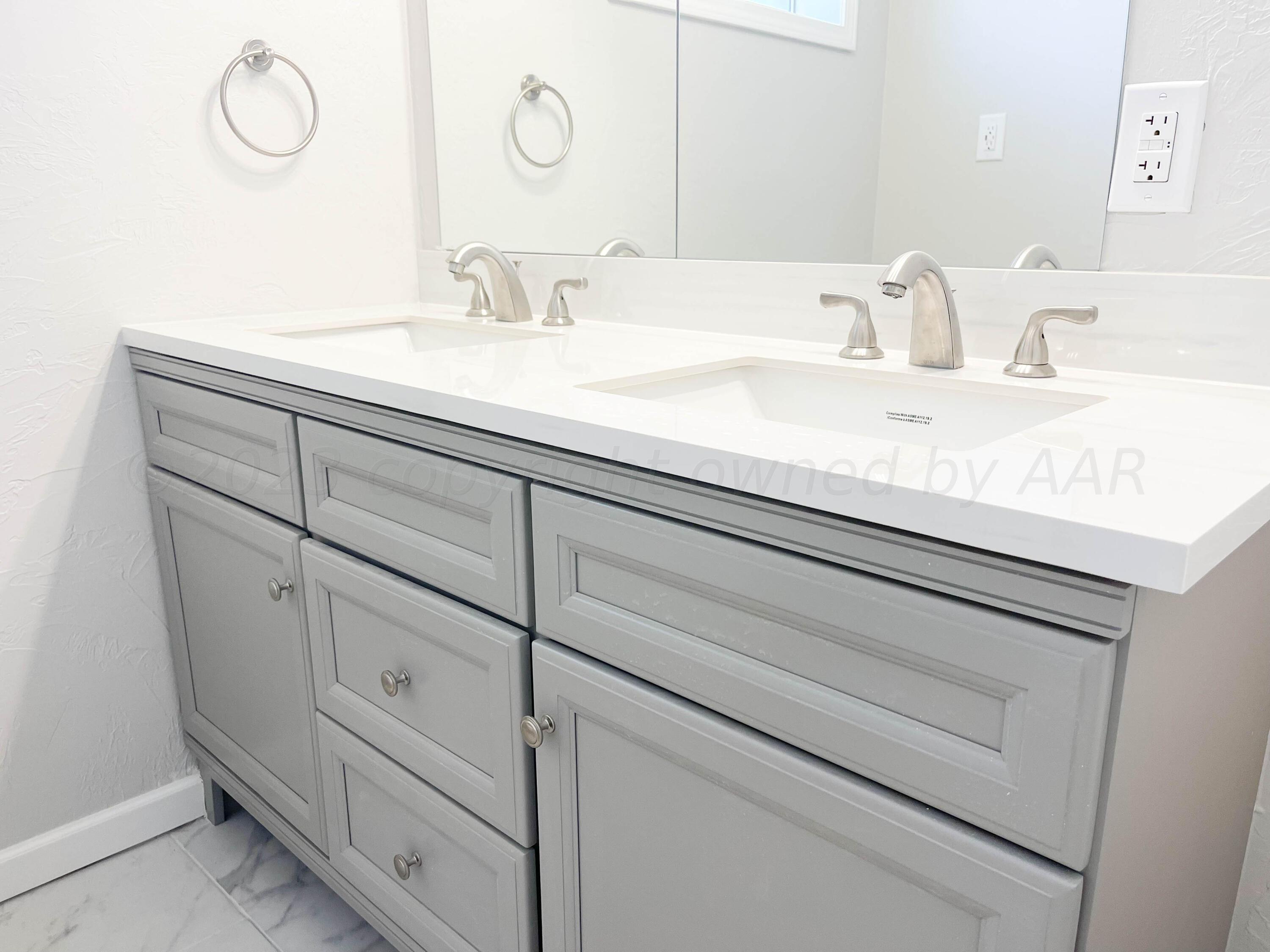 3707 Lynette Drive Amarillo, TX 79109 - Photo 28 of 45 a bathroom with a sink and vanity