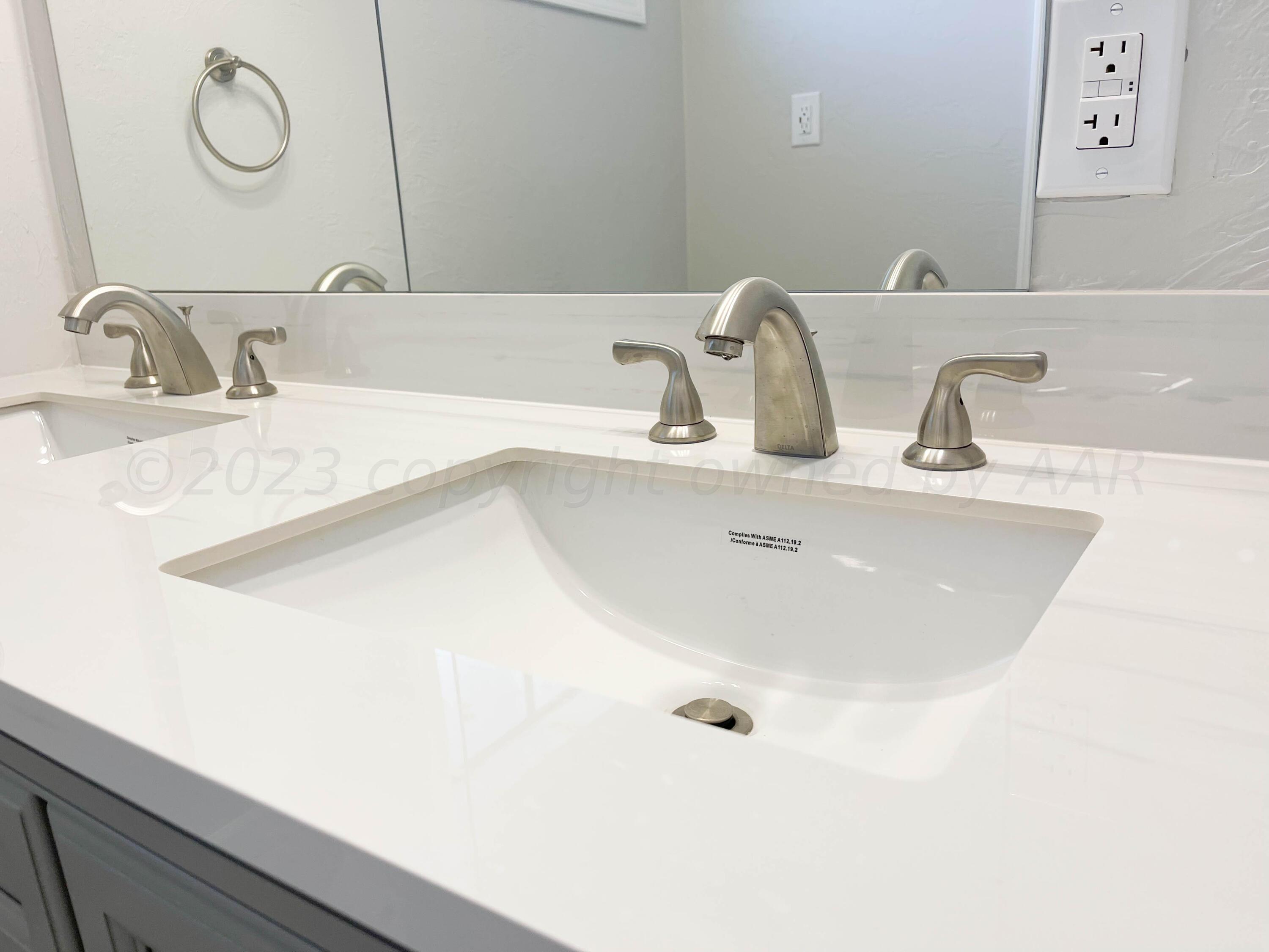 3707 Lynette Drive Amarillo, TX 79109 - Photo 29 of 45 a bathroom with a sink and a mirror