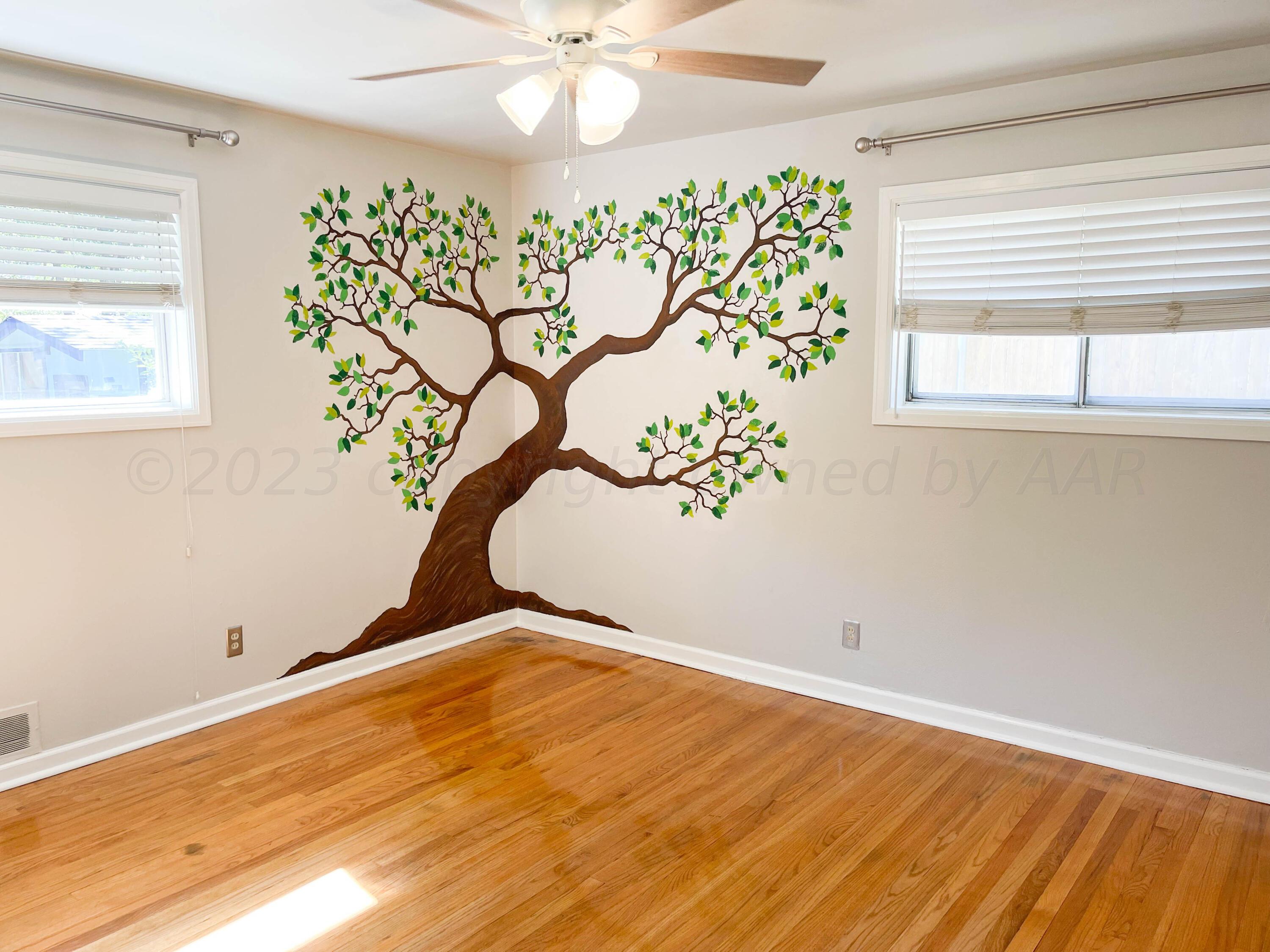 3707 Lynette Drive Amarillo, TX 79109 - Photo 31 of 45 a view of a room with a window and wooden floor