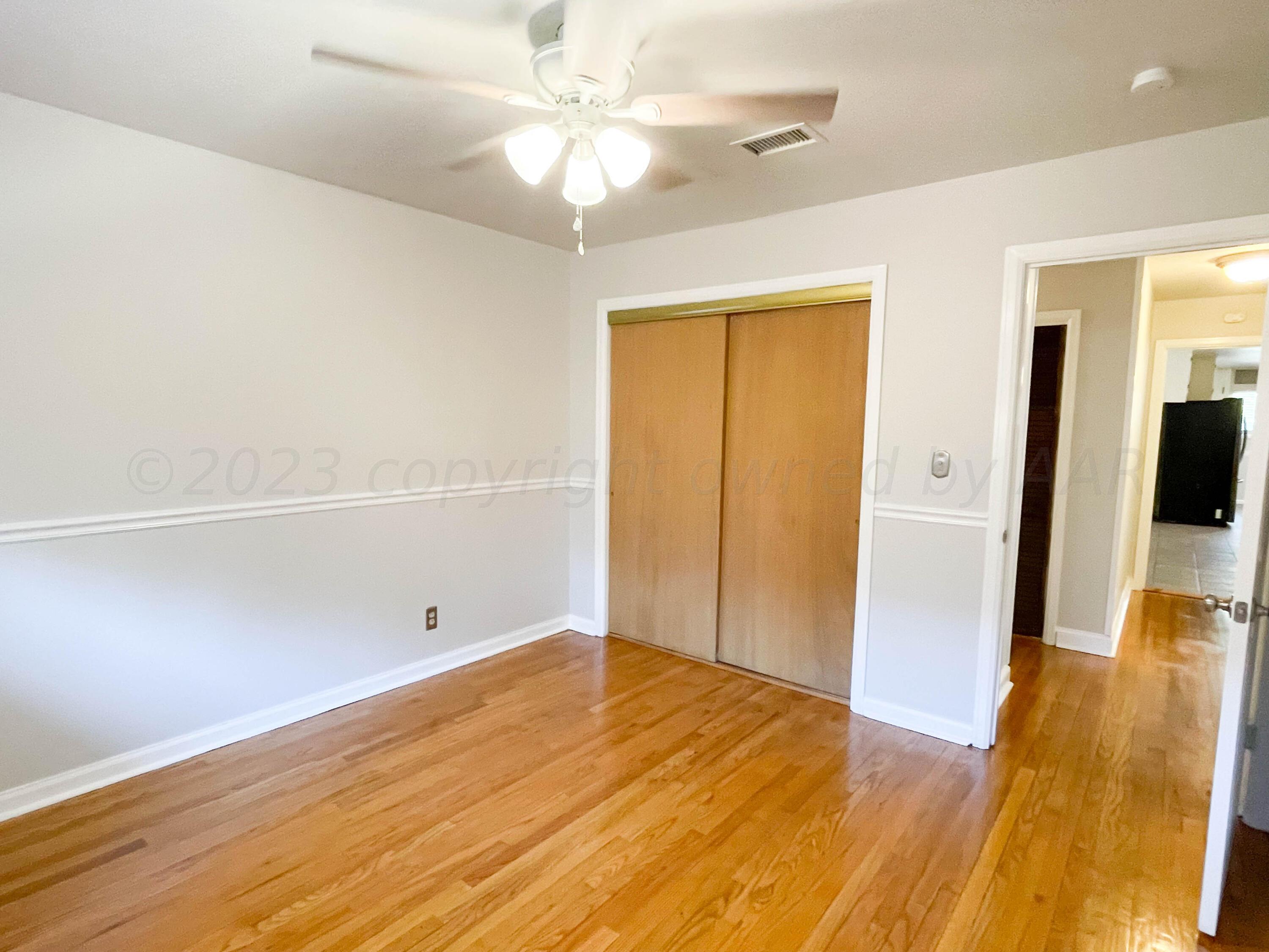 3707 Lynette Drive Amarillo, TX 79109 - Photo 33 of 45 wooden floor in an empty room