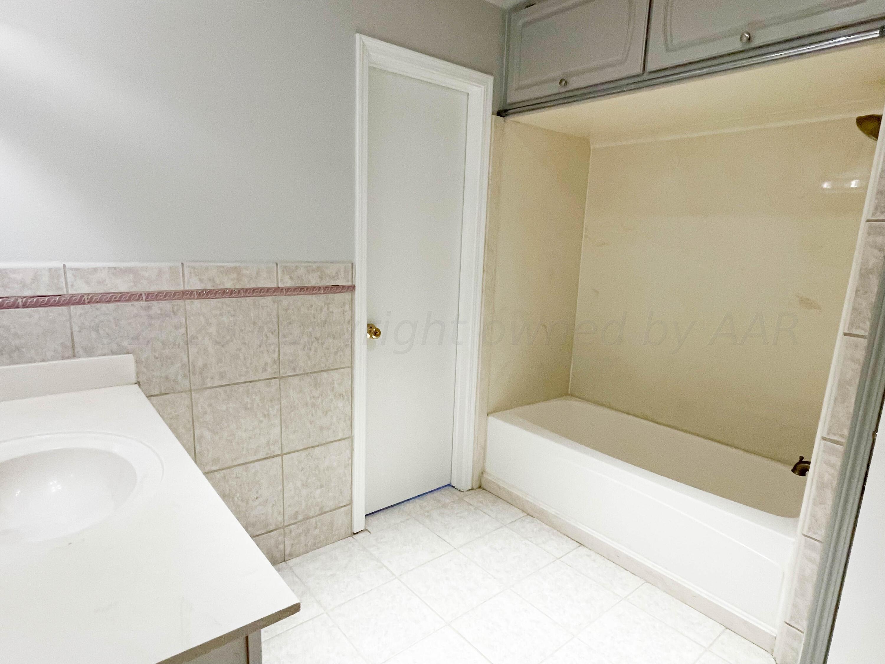 3707 Lynette Drive Amarillo, TX 79109 - Photo 35 of 45 a bathroom with a bathtub