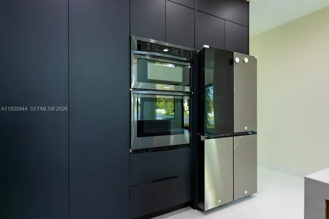 a room with furniture and a large window