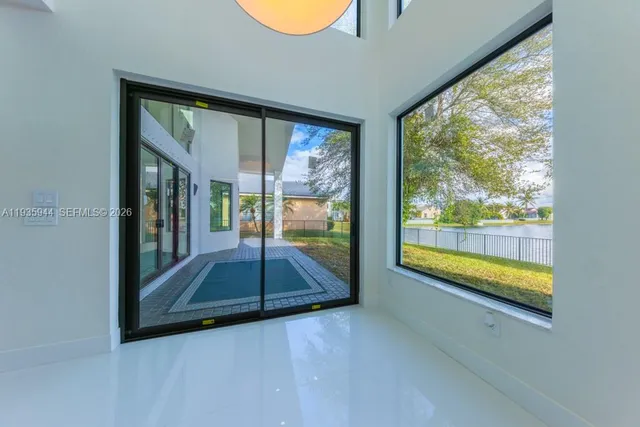 a bathroom with a tub shower vanity and a sink