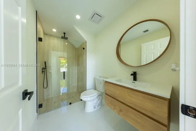 a white bath tub sitting next to a white sink