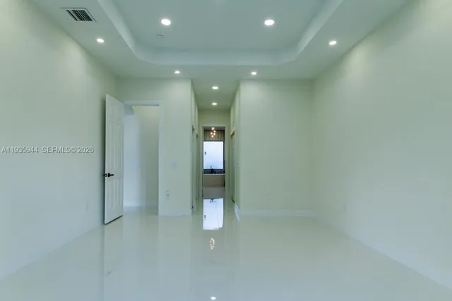 a bathroom with a double vanity sink a toilet and a shower