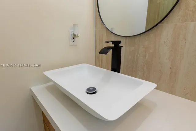 a view of a hallway with two large window