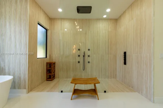 a bathroom with a toilet a sink and a mirror