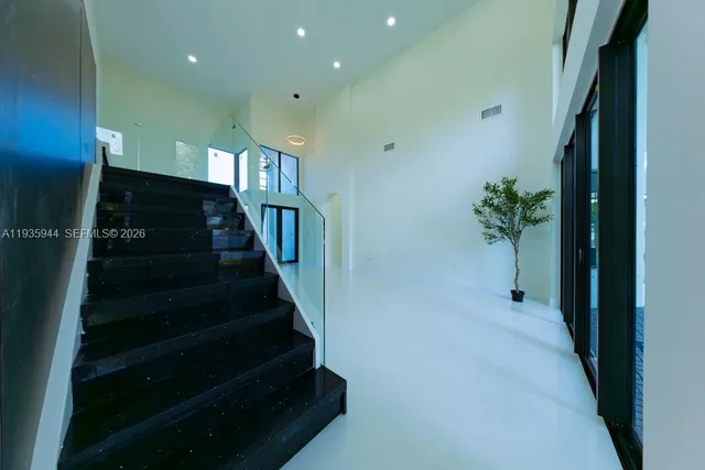 a kitchen with stainless steel appliances kitchen island a refrigerator and a stove