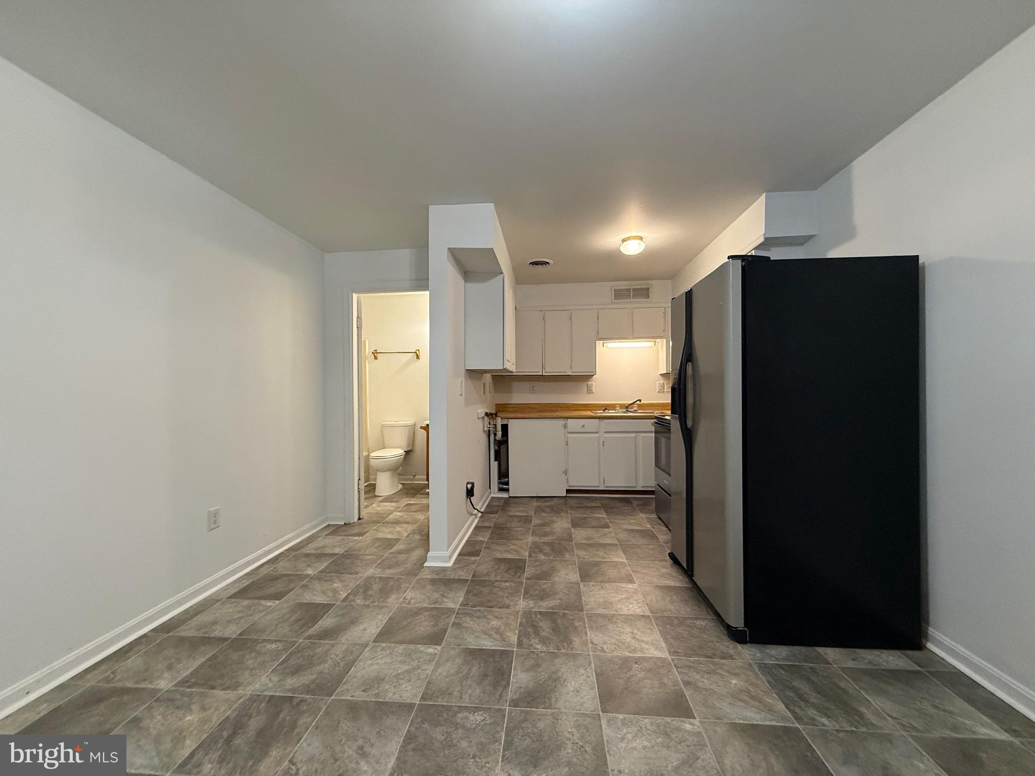 2315 Oak Park Road, Unit B Madison, VA 22727 - Photo 2 of 7 a view of a kitchen with a refrigerator and a sink