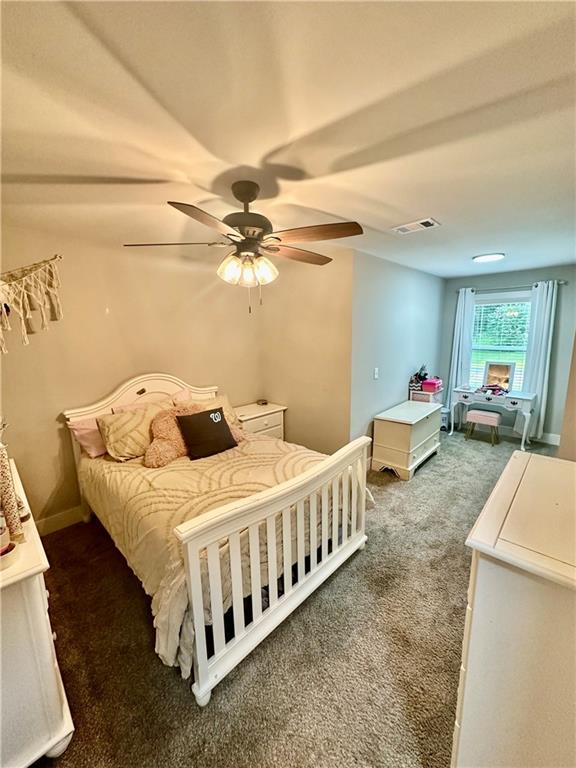 815 Poplar Street Monticello, GA 31064 - Photo 30 of 33 a bed room with a bed and a chair