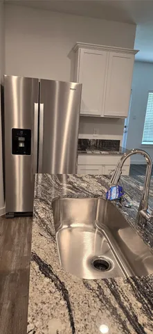 a view of a kitchen with a sink
