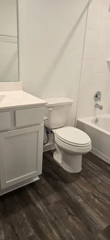 a bathroom with a sink toilet and vanity