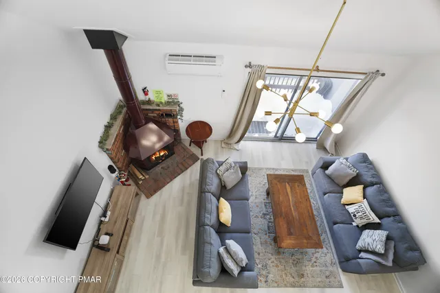 a view of living room with furniture and a window