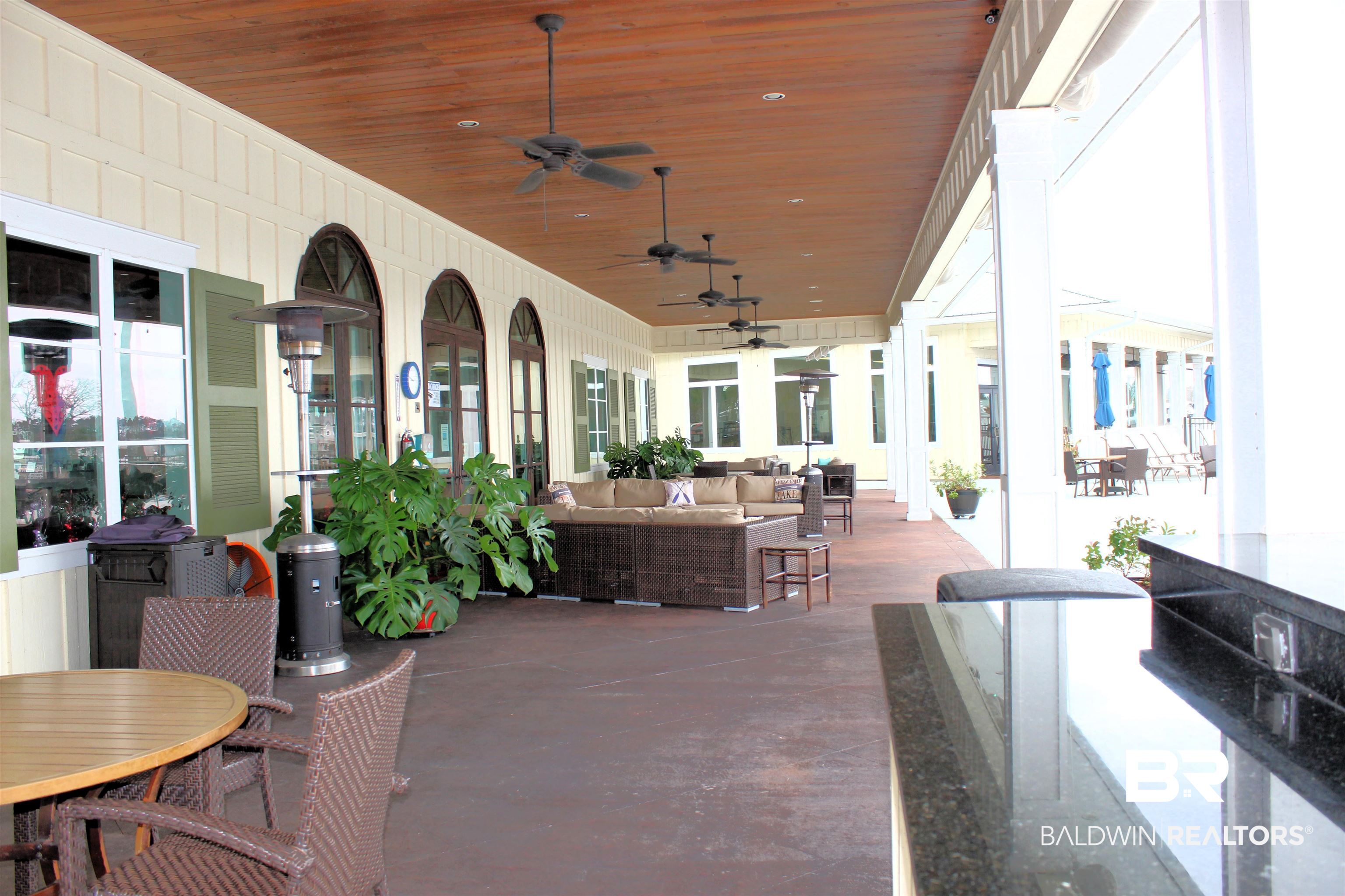 28152 Migratory Way Elberta, AL 36530 - Photo 28 of 54 View of patio / terrace featuring outdoor lounge area, outdoor dining area, and a ceiling fan