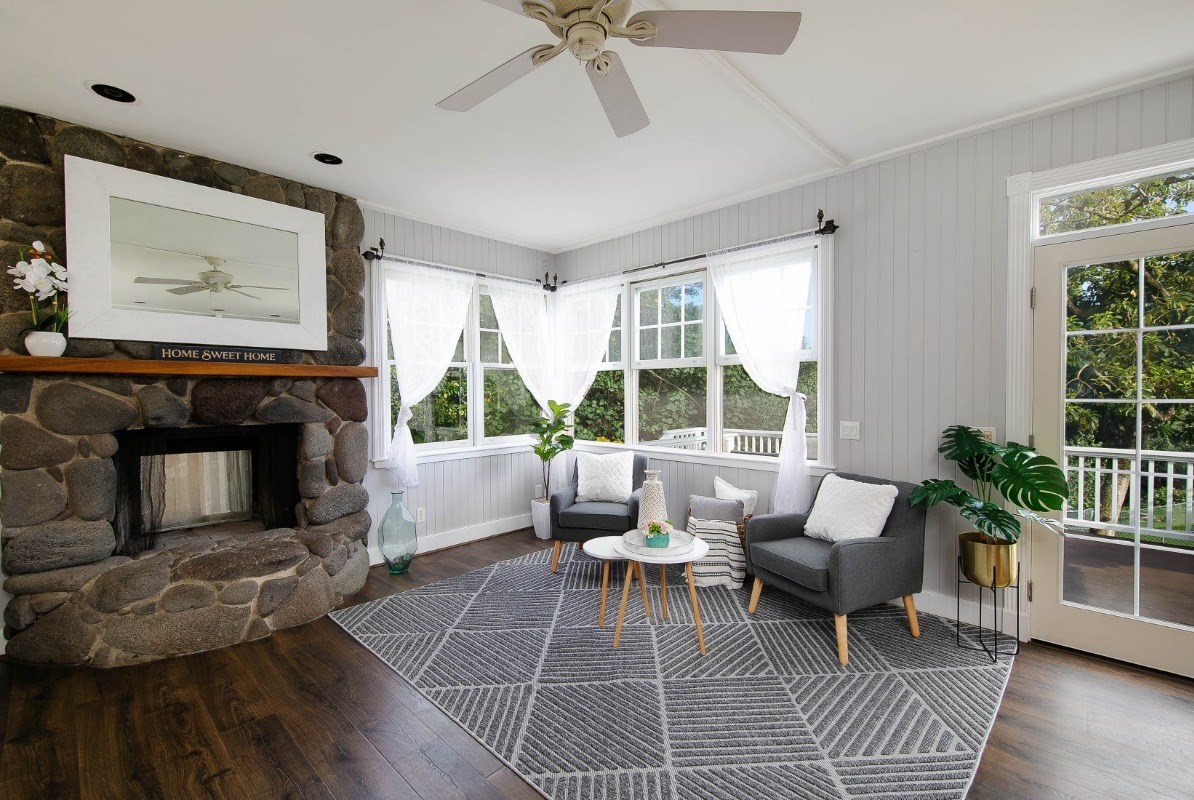 4368 Omao Road Koloa, HI 96756 - Photo 2 of 30 a living room with furniture a window and a fireplace