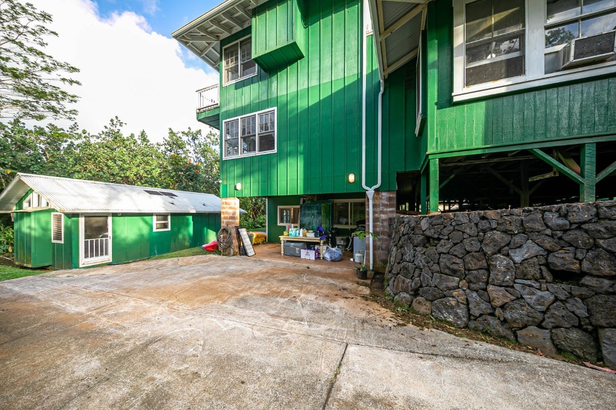 4368 Omao Road Koloa, HI 96756 - Photo 22 of 30 a view of a patio with a table and chairs under an umbrella
