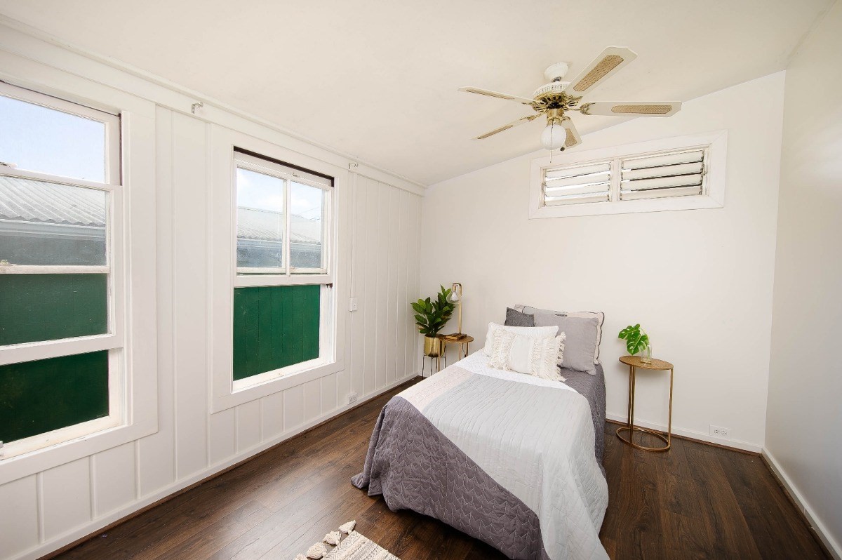 4368 Omao Road Koloa, HI 96756 - Photo 10 of 30 a bedroom with a bed and window