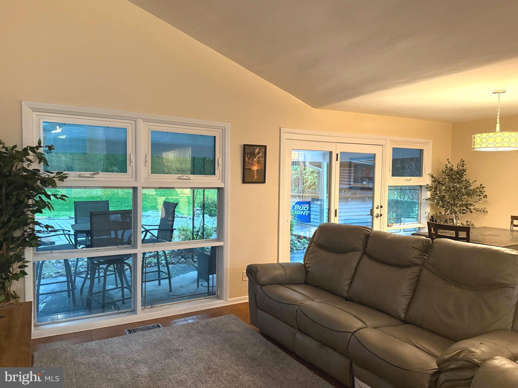 450 Foster Drive Springfield, PA 19064 - Photo 10 of 16 a living room with furniture windows and potted plants