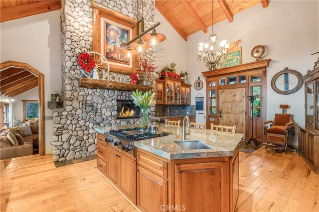 a kitchen with stainless steel appliances granite countertop a sink and cabinets