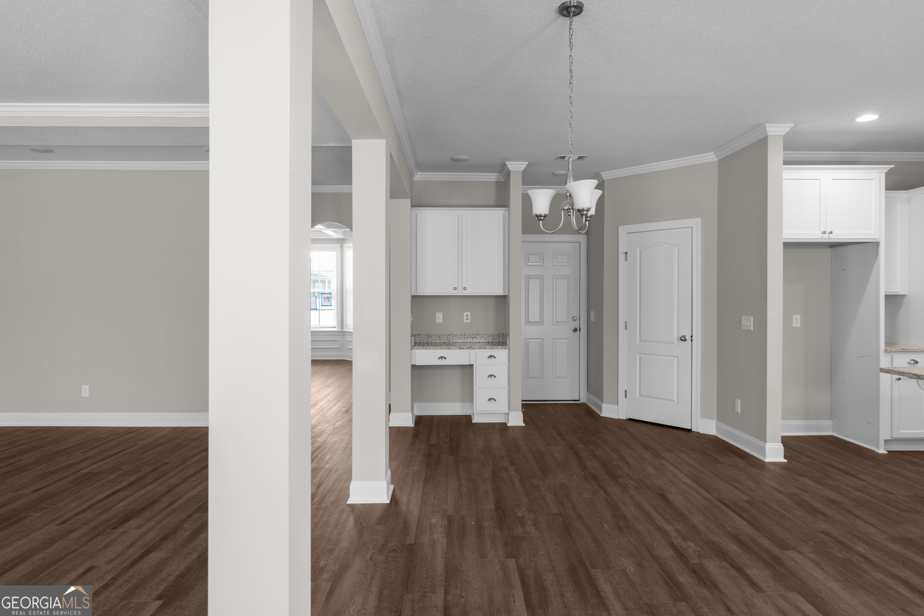 140 Watson Mill Road Guyton, GA 31312 - Photo 13 of 32 a view of a kitchen with a refrigerator and wooden floor
