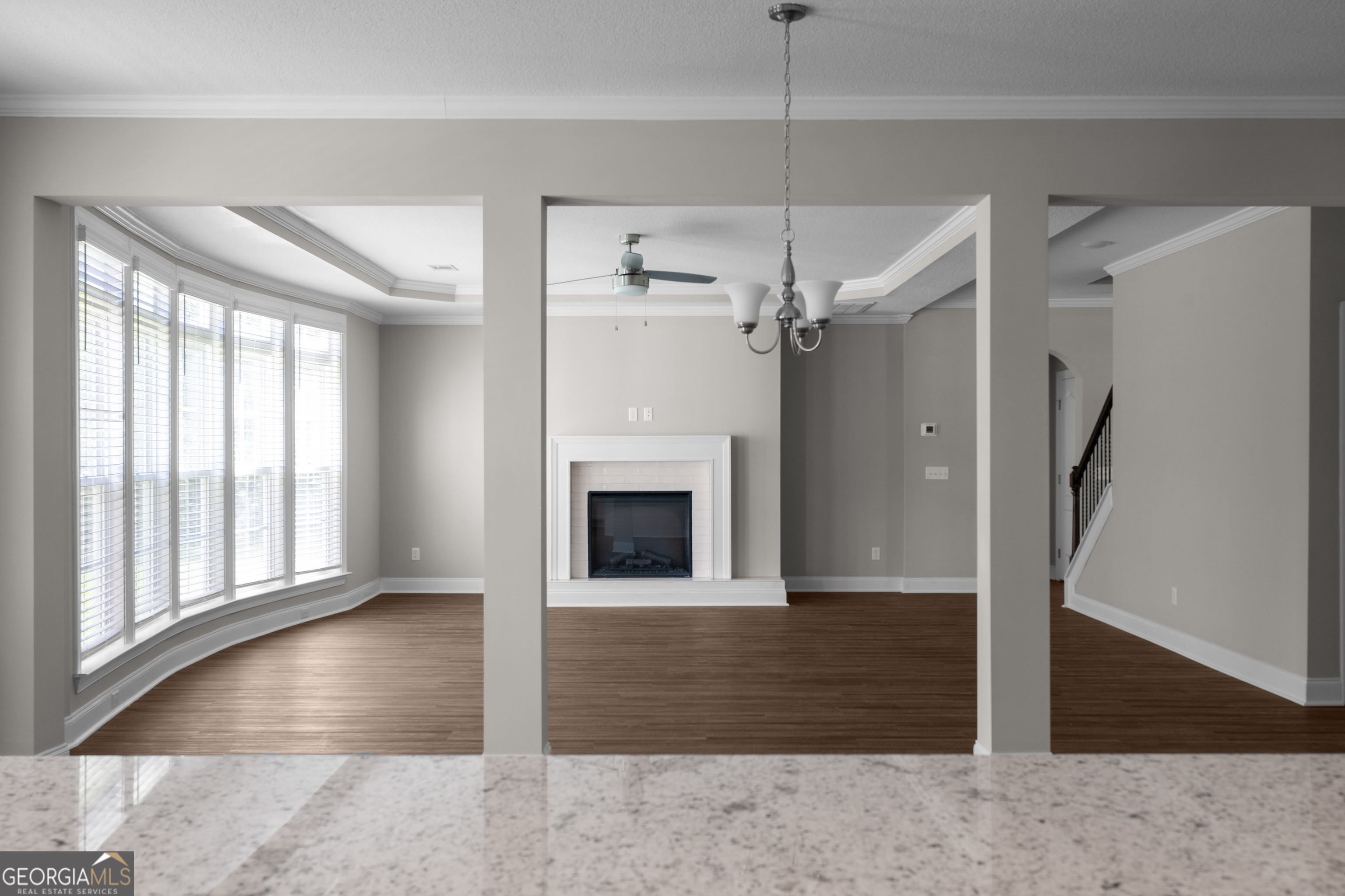 140 Watson Mill Road Guyton, GA 31312 - Photo 14 of 32 a view of a livingroom with a fireplace cabinet and windows