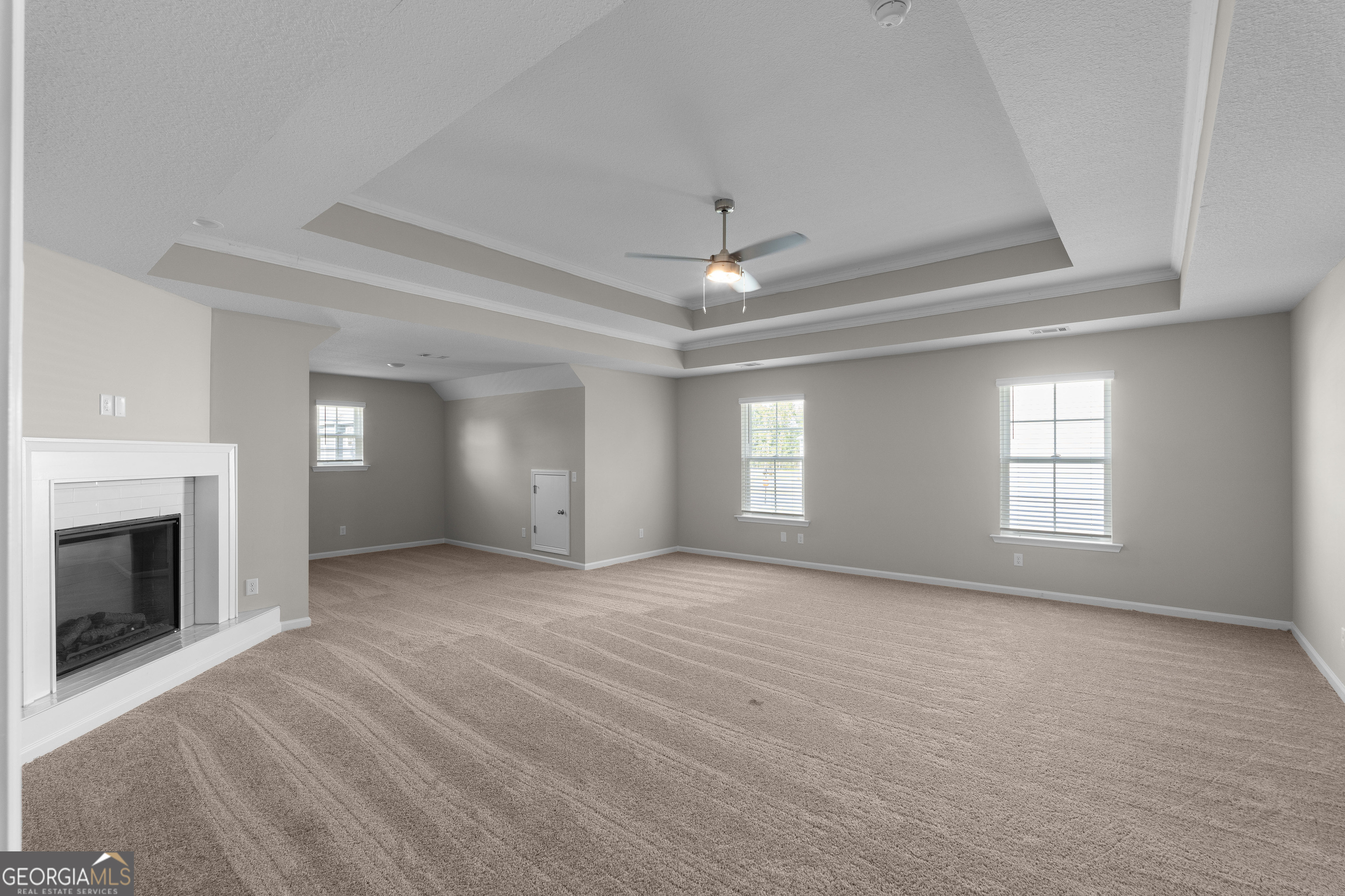 140 Watson Mill Road Guyton, GA 31312 - Photo 18 of 32 a view of an empty room with window and fireplace