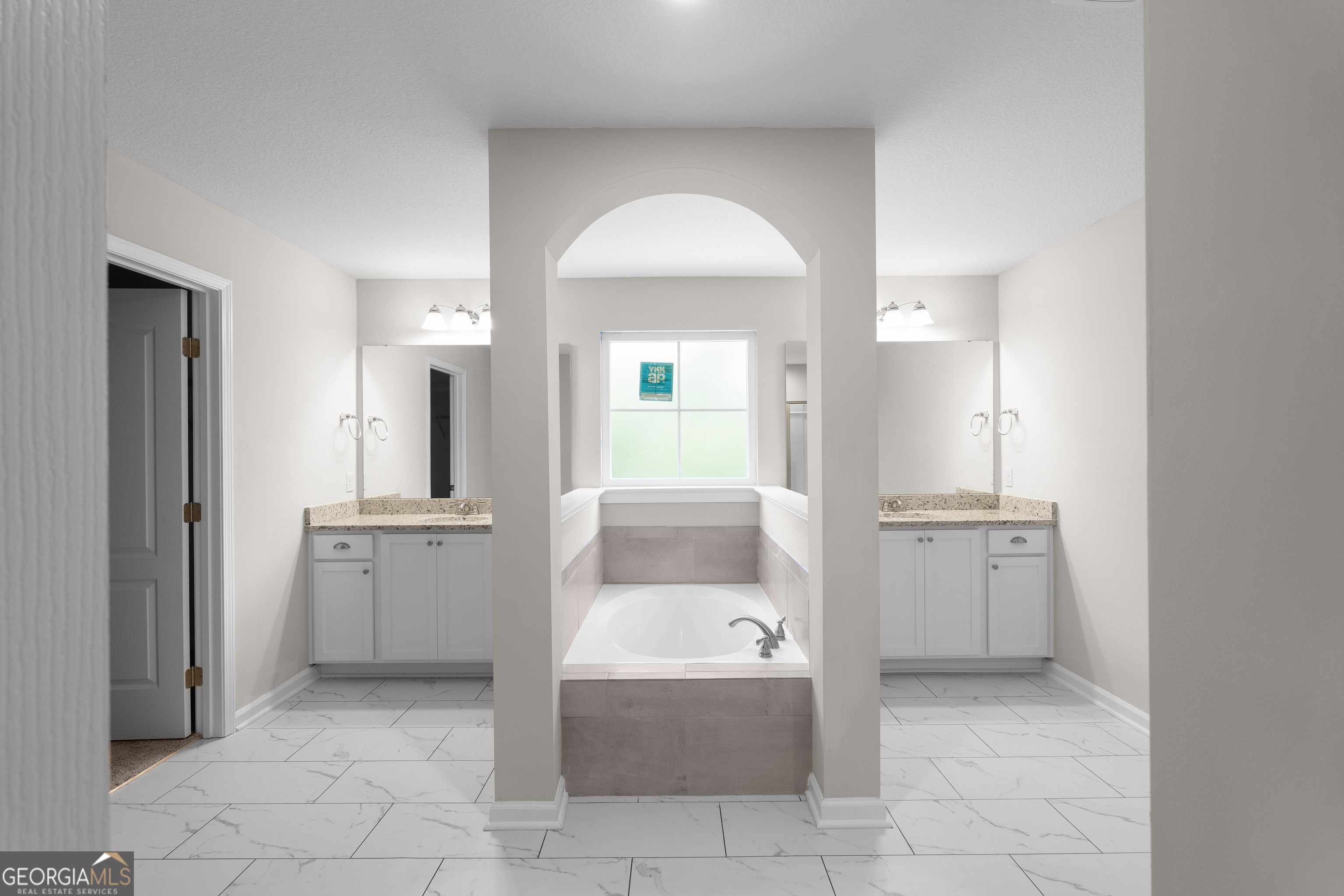 140 Watson Mill Road Guyton, GA 31312 - Photo 21 of 32 a bathroom with a tub sink and mirror