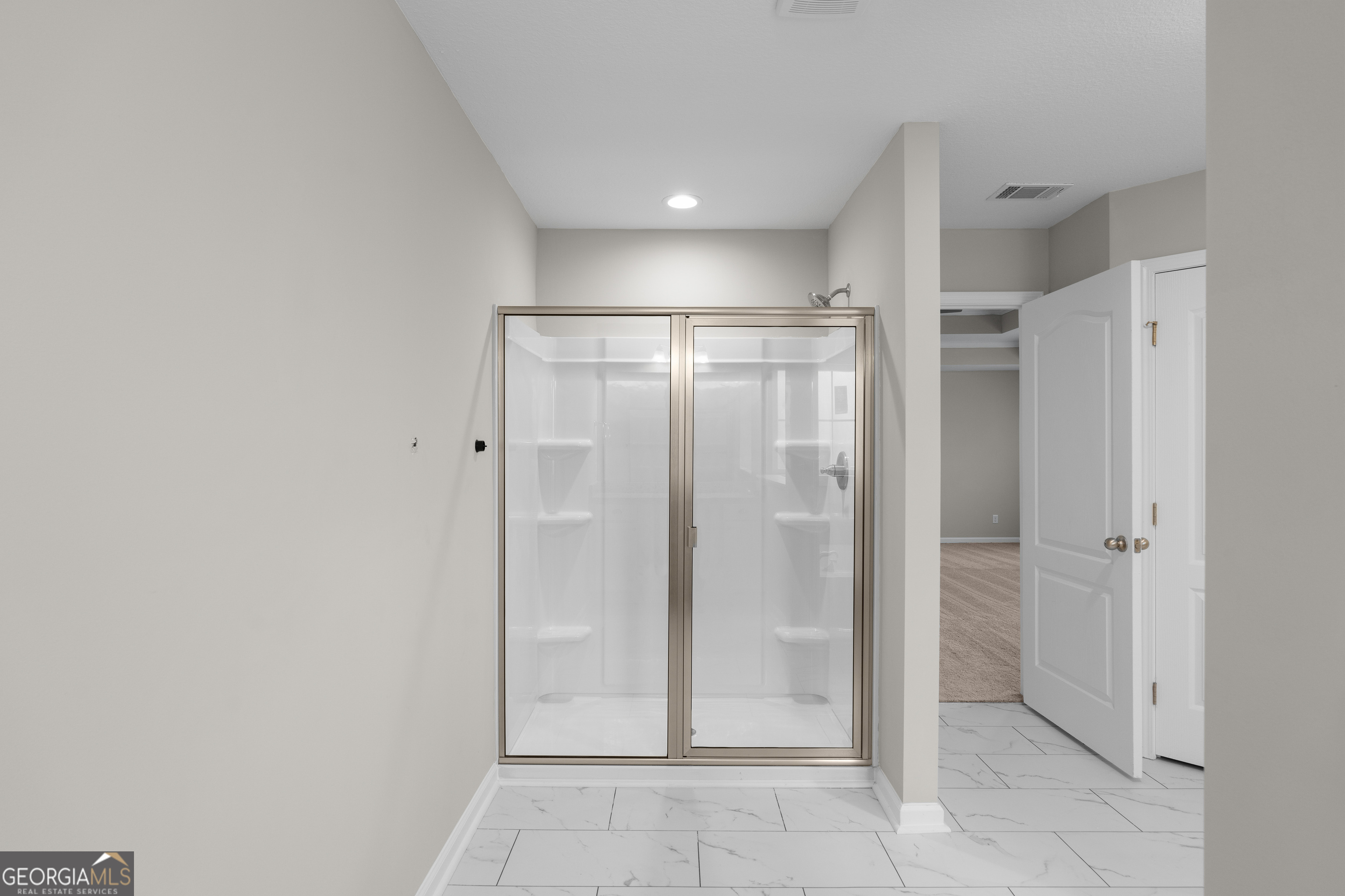 140 Watson Mill Road Guyton, GA 31312 - Photo 22 of 32 a bathroom with a shower and closet