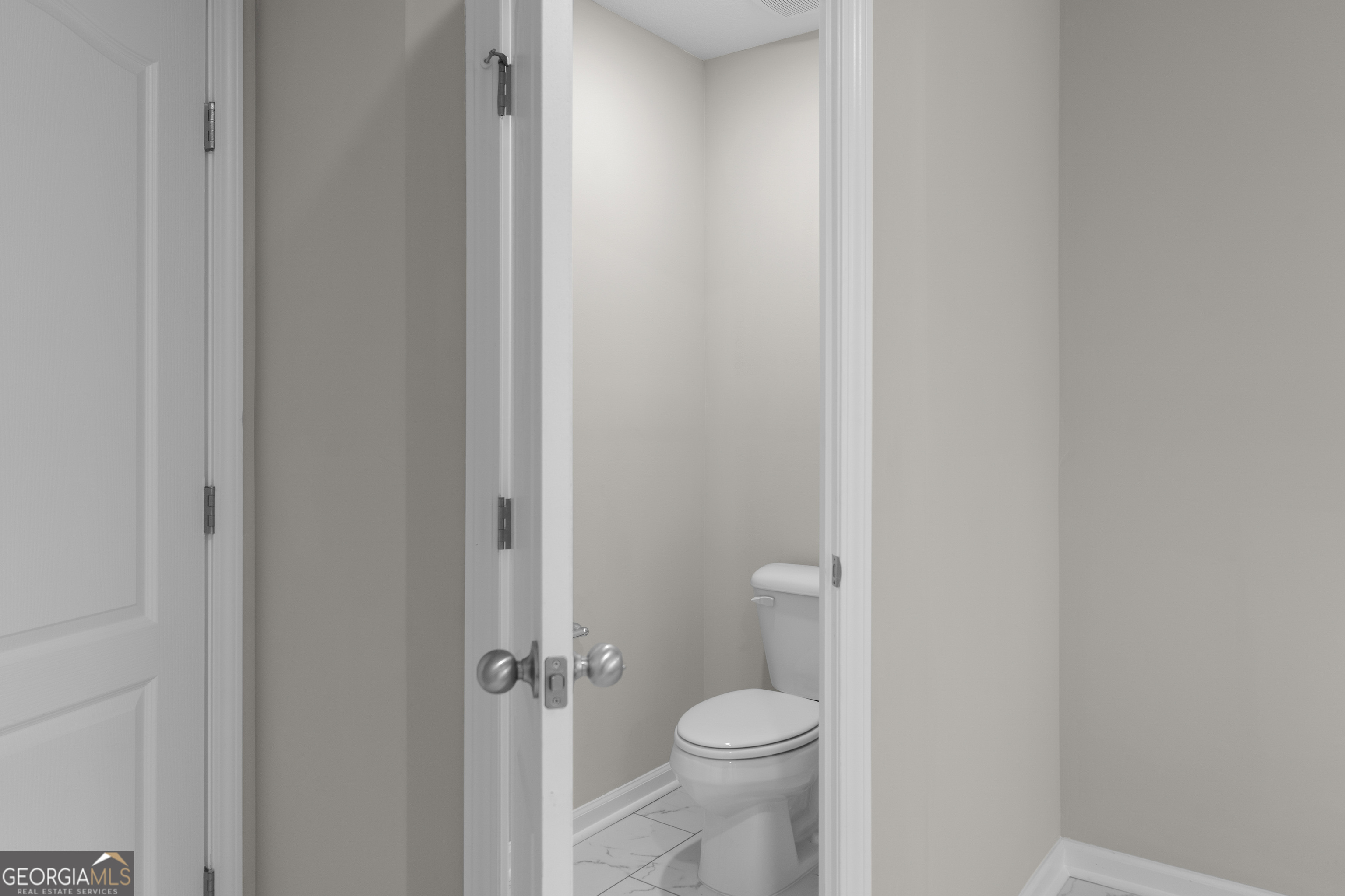 140 Watson Mill Road Guyton, GA 31312 - Photo 23 of 32 a bathroom with a granite countertop toilet and a sink