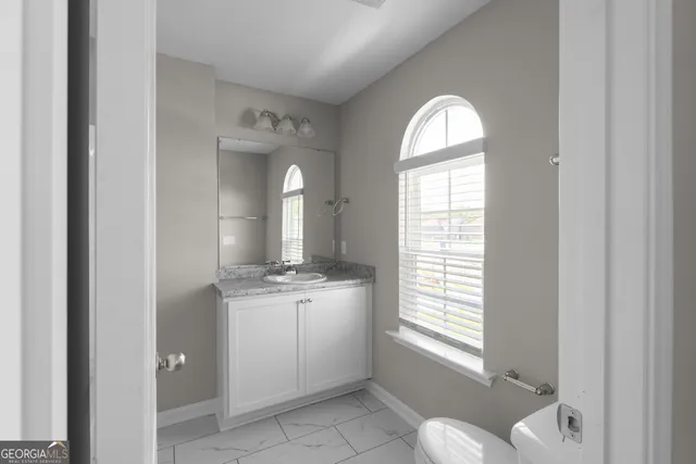 a view of a livingroom with windows