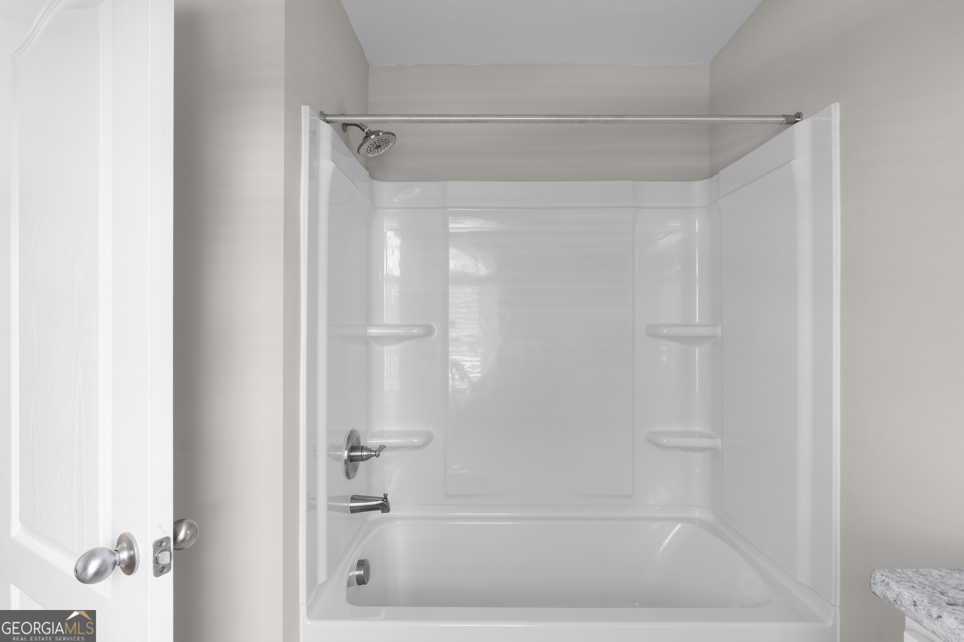 140 Watson Mill Road Guyton, GA 31312 - Photo 27 of 32 a bathroom with a glass shower door