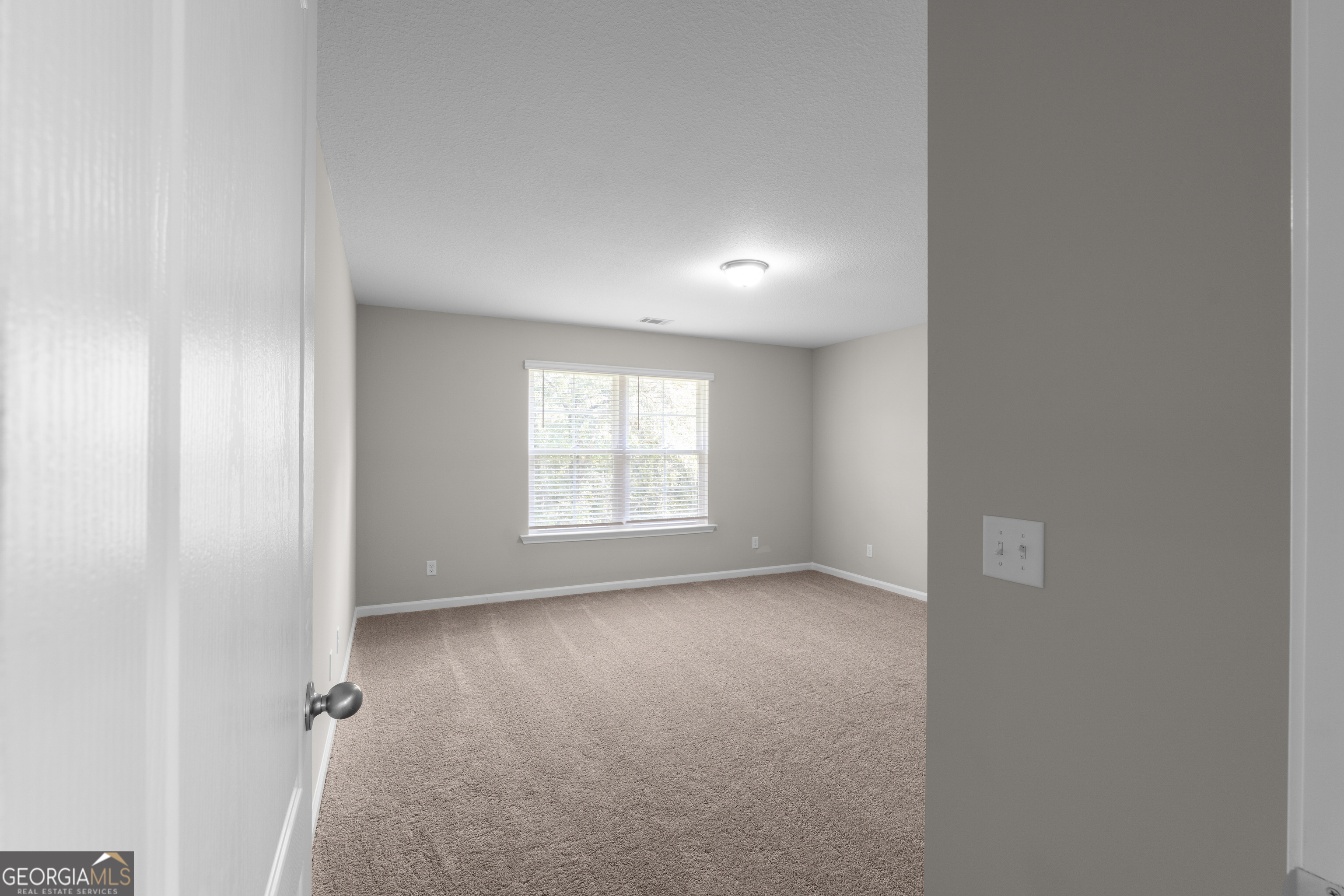 140 Watson Mill Road Guyton, GA 31312 - Photo 28 of 32 an empty room with a window