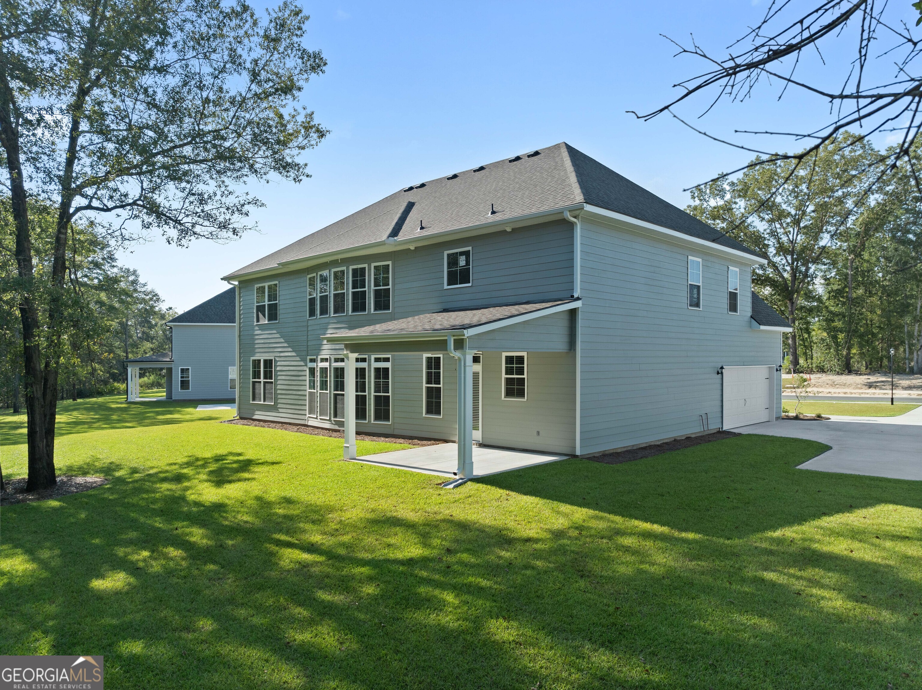 140 Watson Mill Road Guyton, GA 31312 - Photo 30 of 32 a front view of house with yard and green space