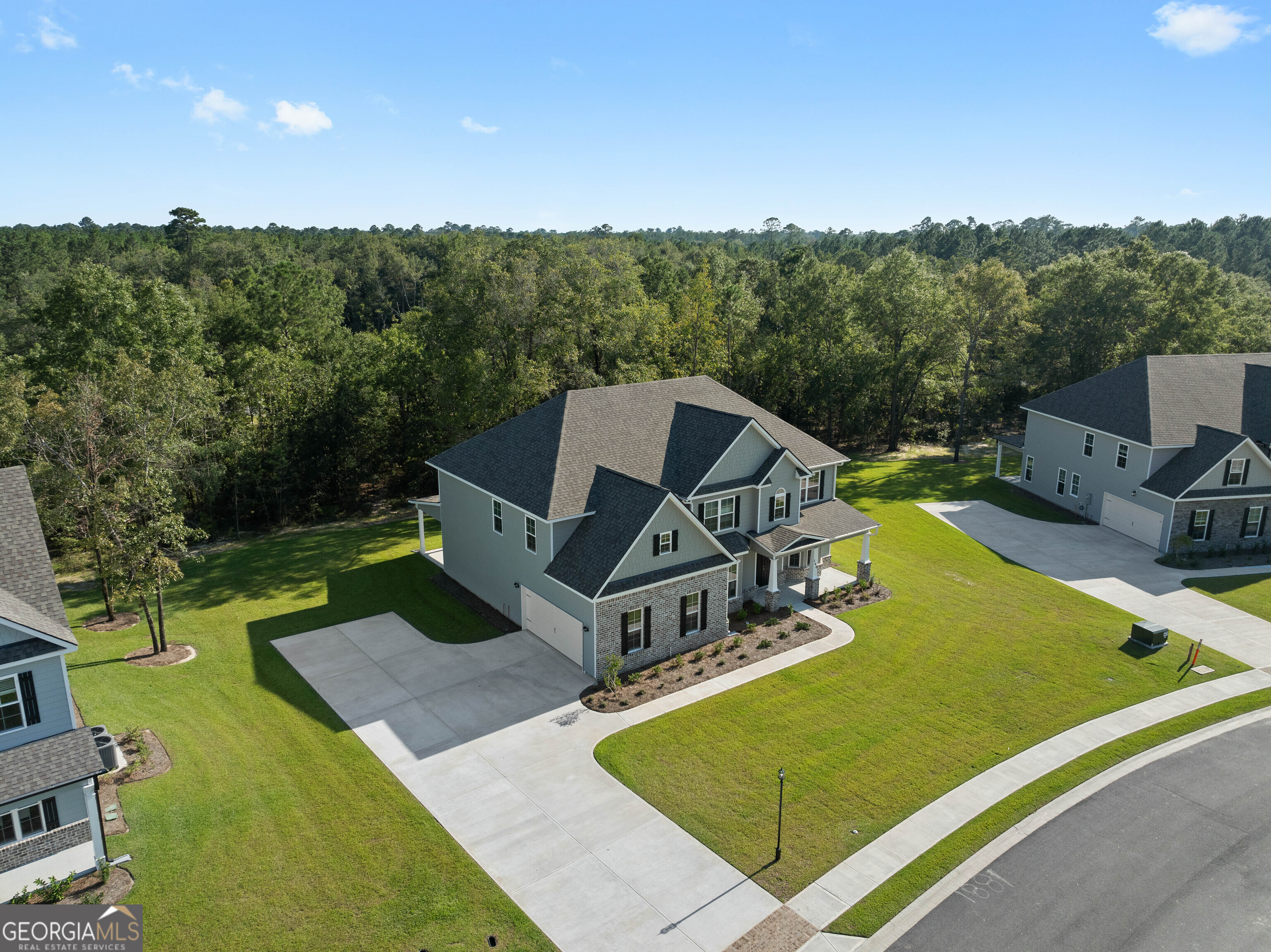 140 Watson Mill Road Guyton, GA 31312 - Photo 3 of 32 a view of a swimming pool with a patio