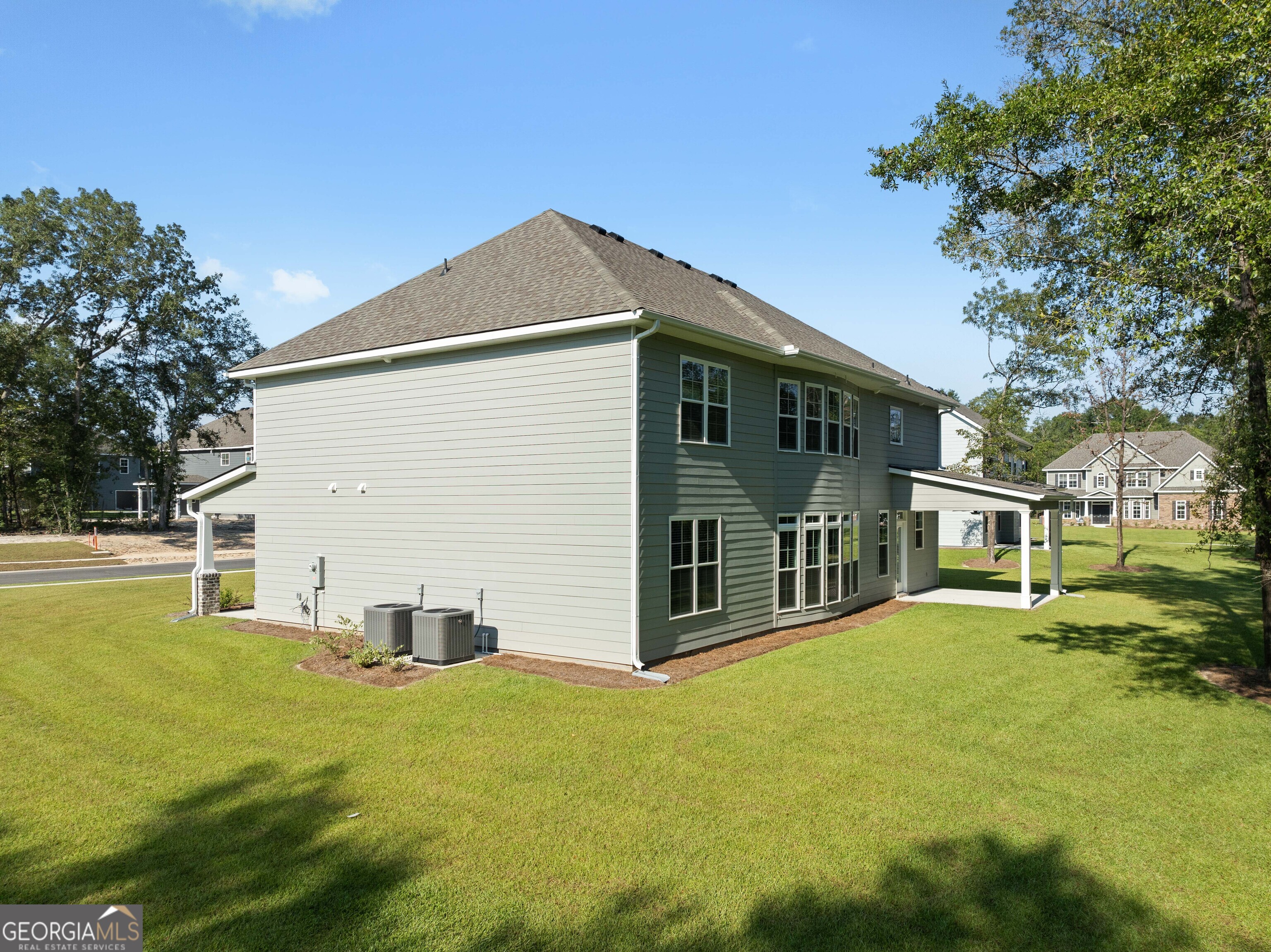 140 Watson Mill Road Guyton, GA 31312 - Photo 31 of 32 a view of a house with a yard