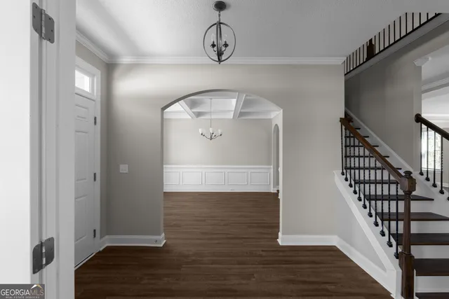 a view of entryway with wooden floor