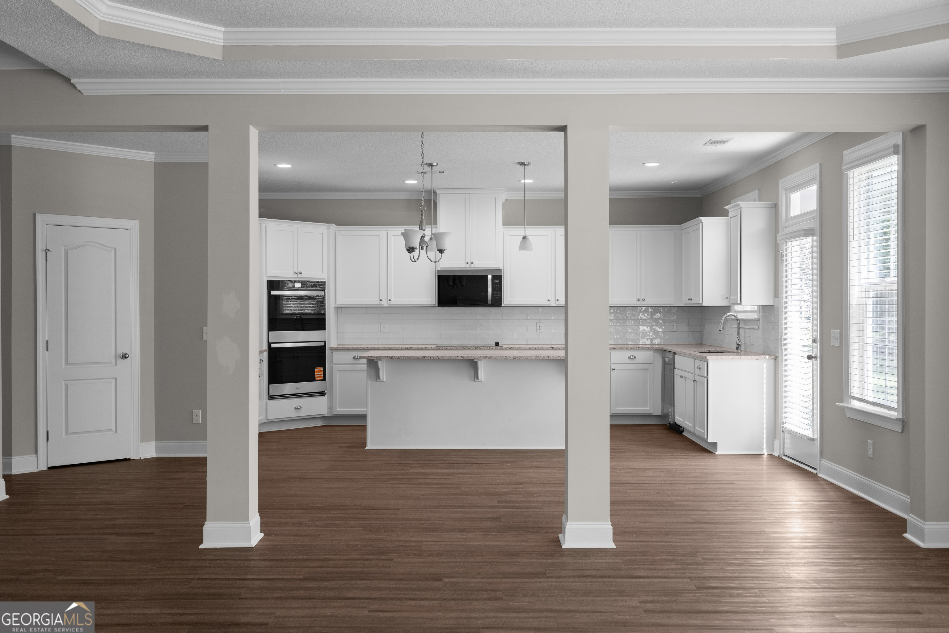 140 Watson Mill Road Guyton, GA 31312 - Photo 10 of 32 a view of kitchen with wooden floor and electronic appliances