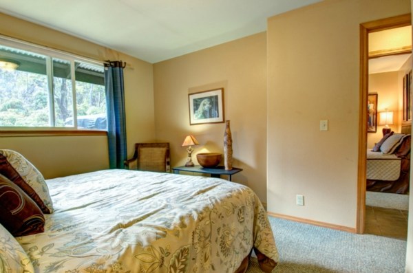 11-3125 Kaleponi Road Mountain View, HI 96771 - Photo 20 of 25 a bedroom with a bed and wooden floor