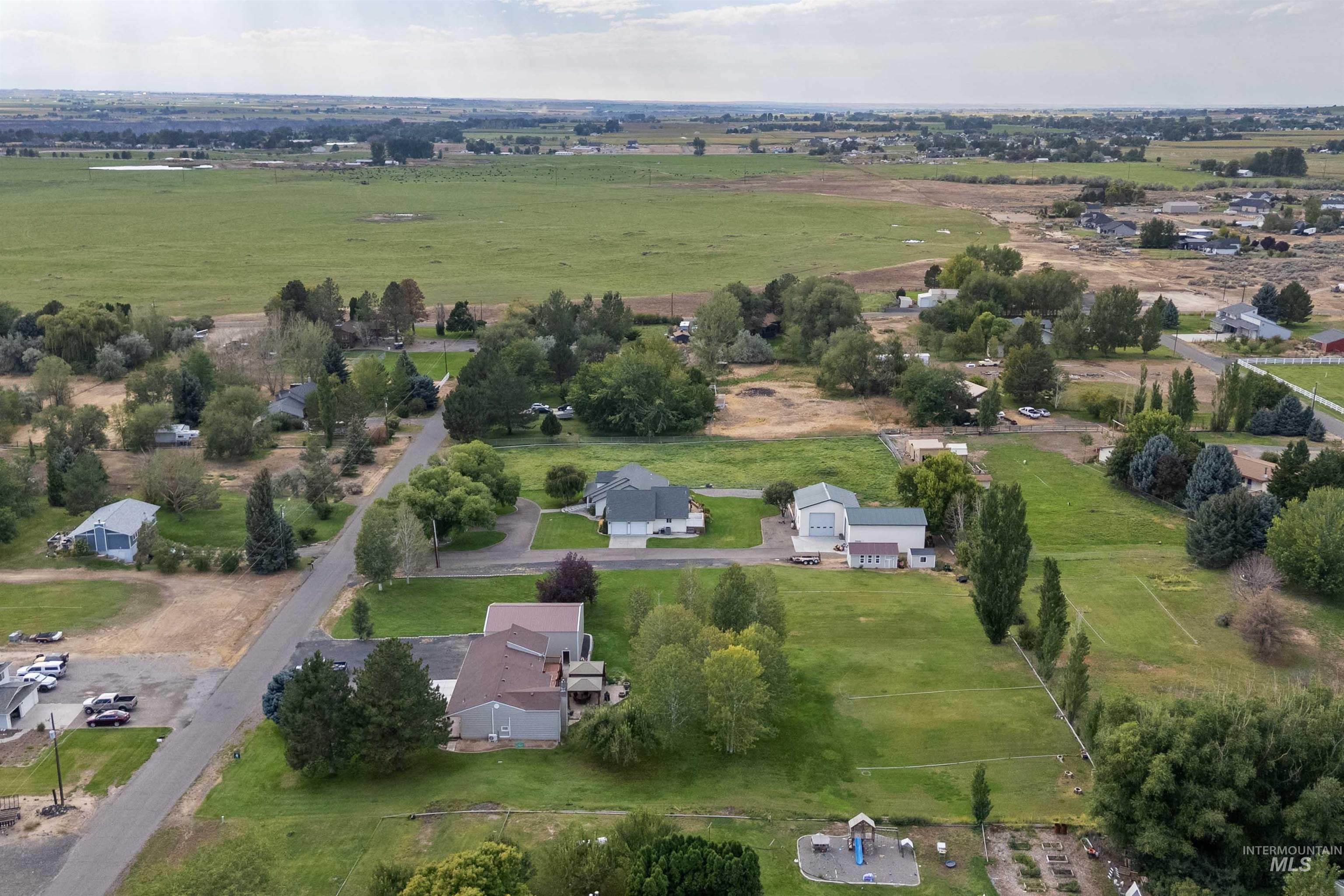 216 Ranch View Road West Jerome, ID 83338 - Photo 37 of 42 Expansive rural setting with established homes, paved roadways, and mature landscaping