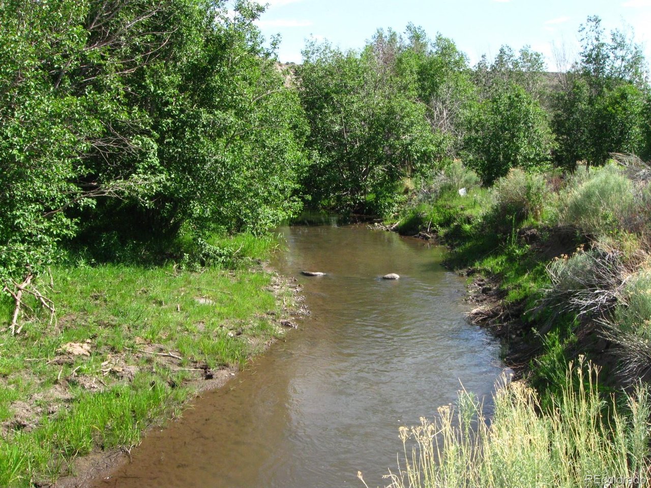 23 Canyon Road Antonito, CO 81120 - Photo 2 of 29 a view of a lake with a yard