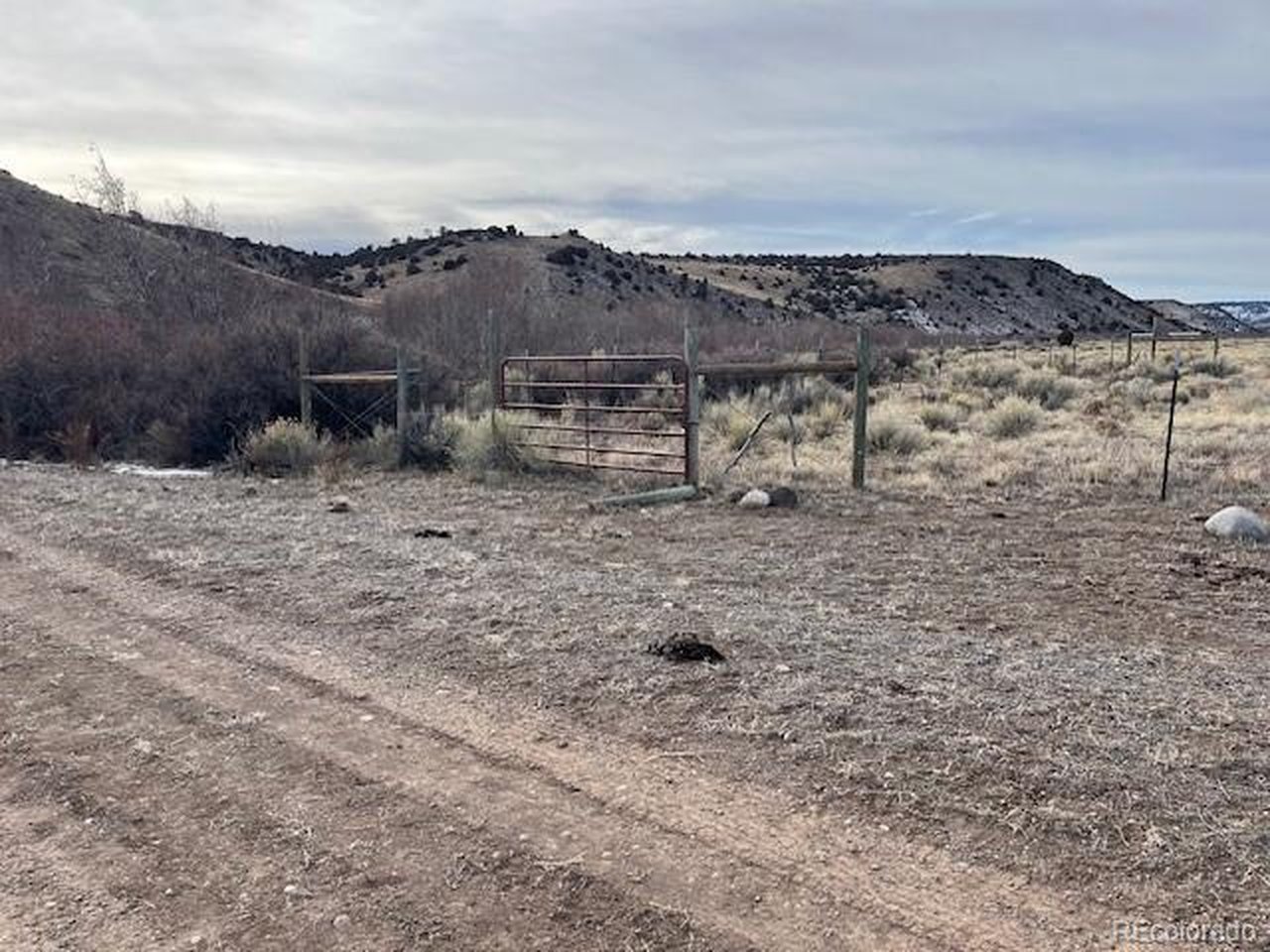 23 Canyon Road Antonito, CO 81120 - Photo 10 of 29 a view of a dry yard with a barn