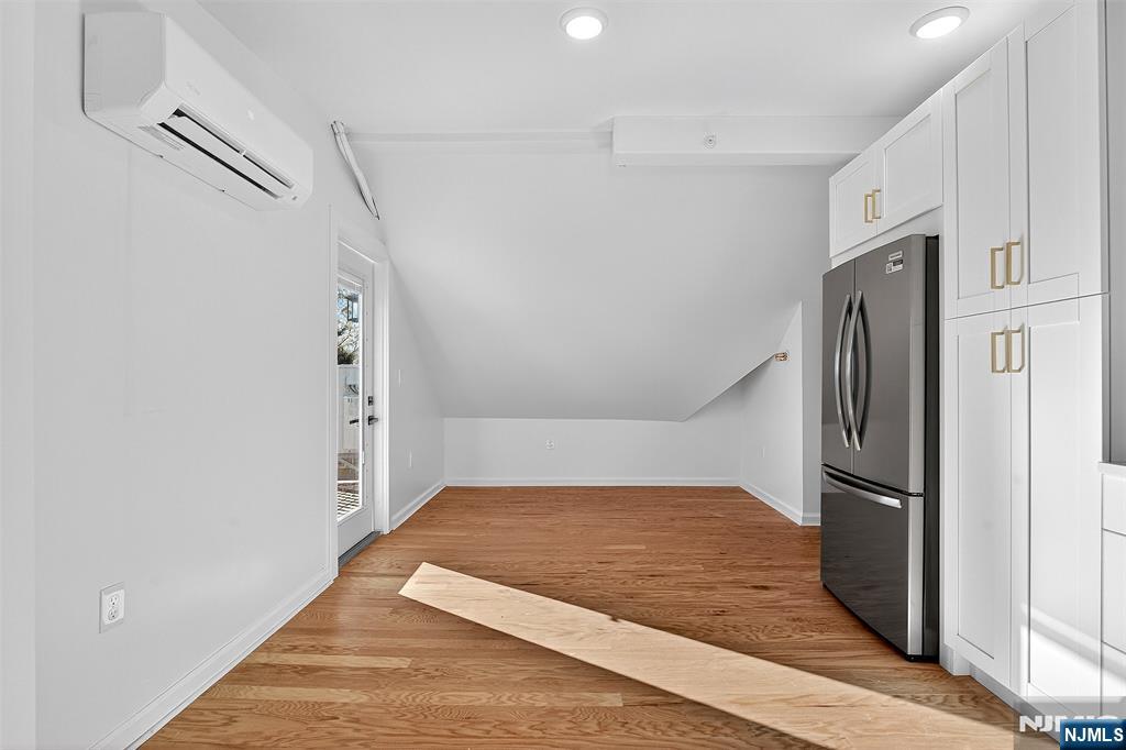 167 Harrison Avenue, Unit 3 Montclair, NJ 07042 - Photo 5 of 20 a kitchen with stainless steel appliances granite countertop a refrigerator and a stove